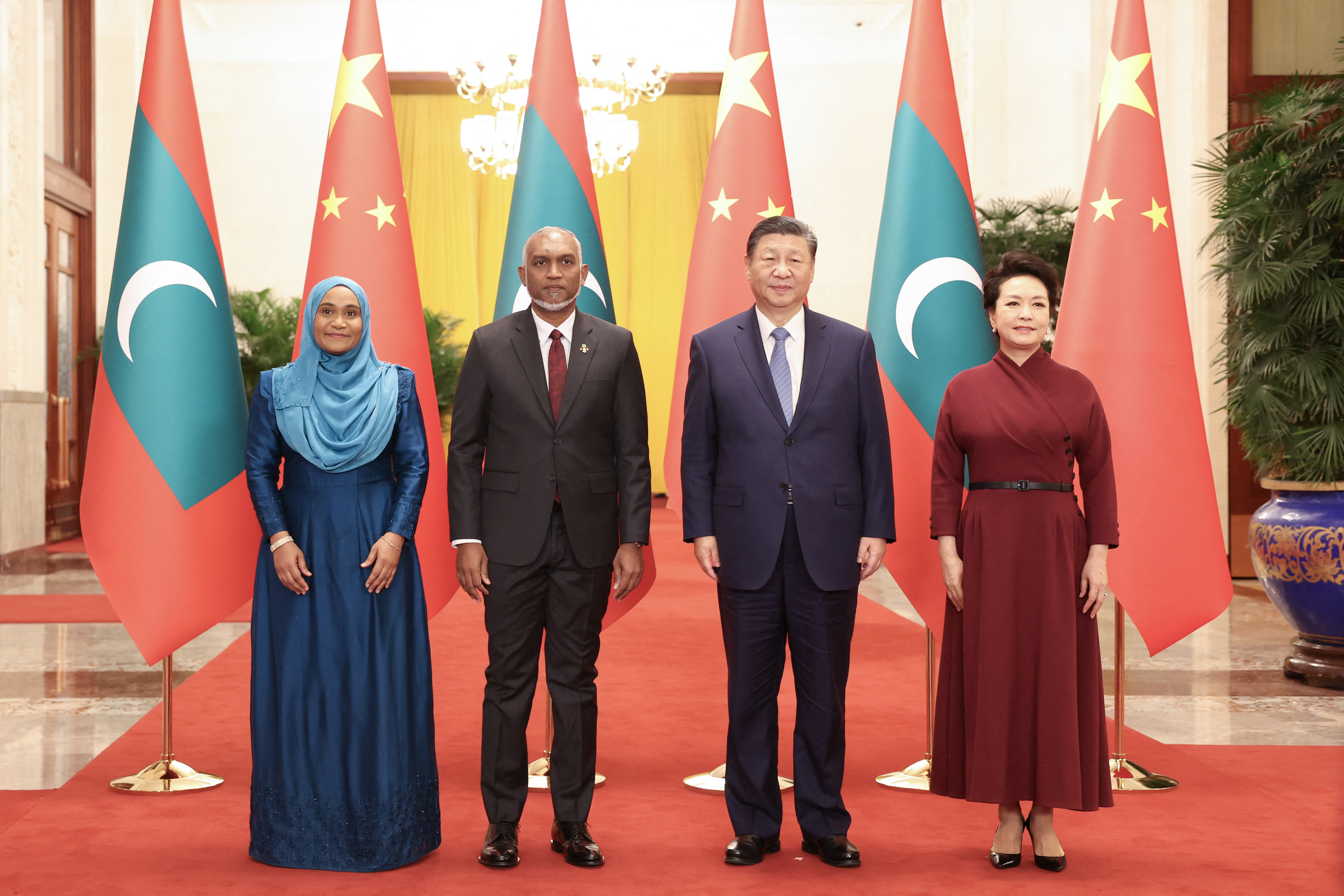 Maldives’ President Mohamed Muizzu (2nd L), his wife Sajidha Mohamed (L), Chinese President Xi Jinping (2nd R) and his wife Peng Liyuan at a welcome ceremony in the Great Hall of the People in Beijing, China, on January 10, 2024 [CNS via AFP]