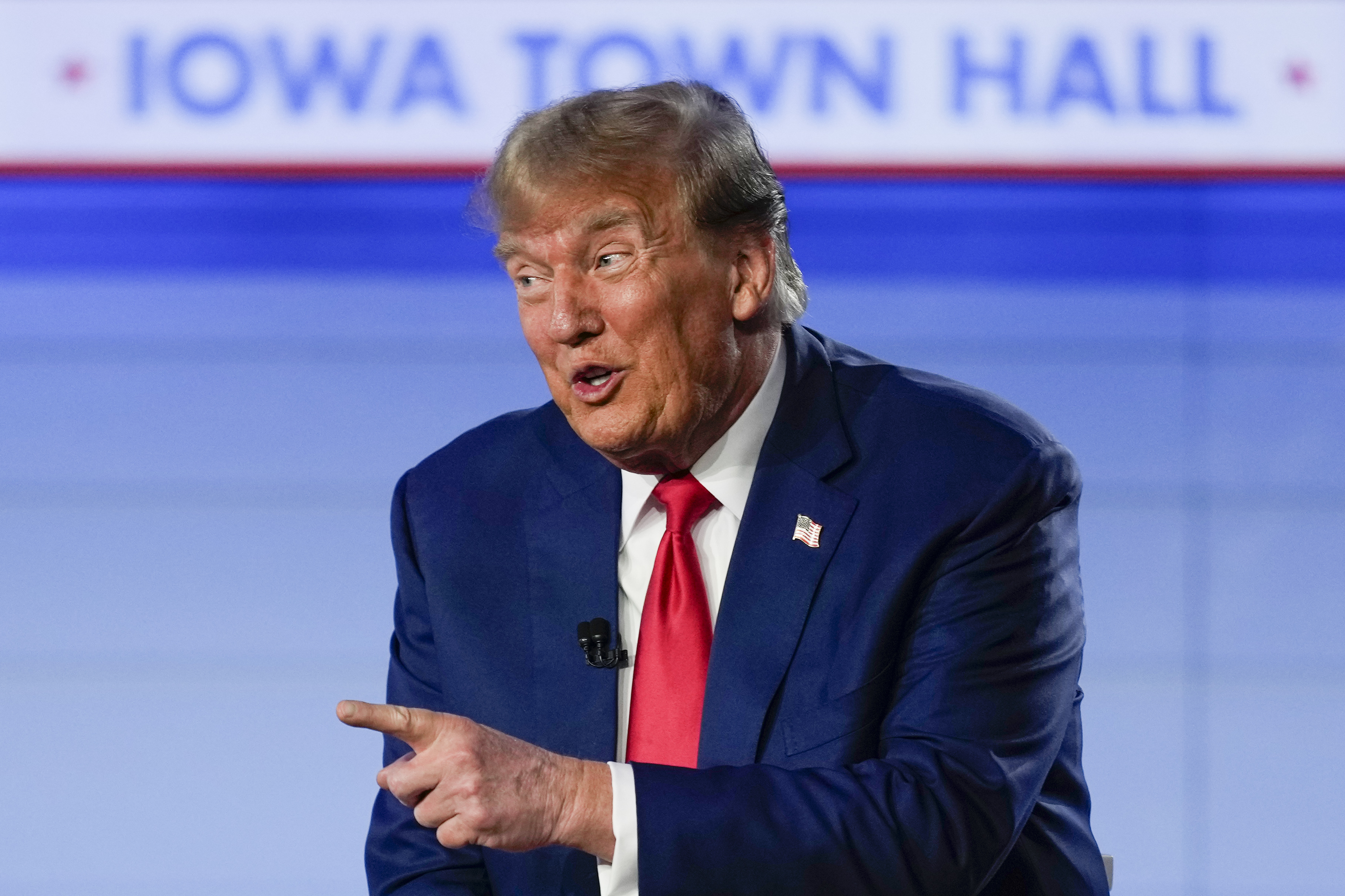 Donald Trump points from the Iowa town hall stage on January 10.