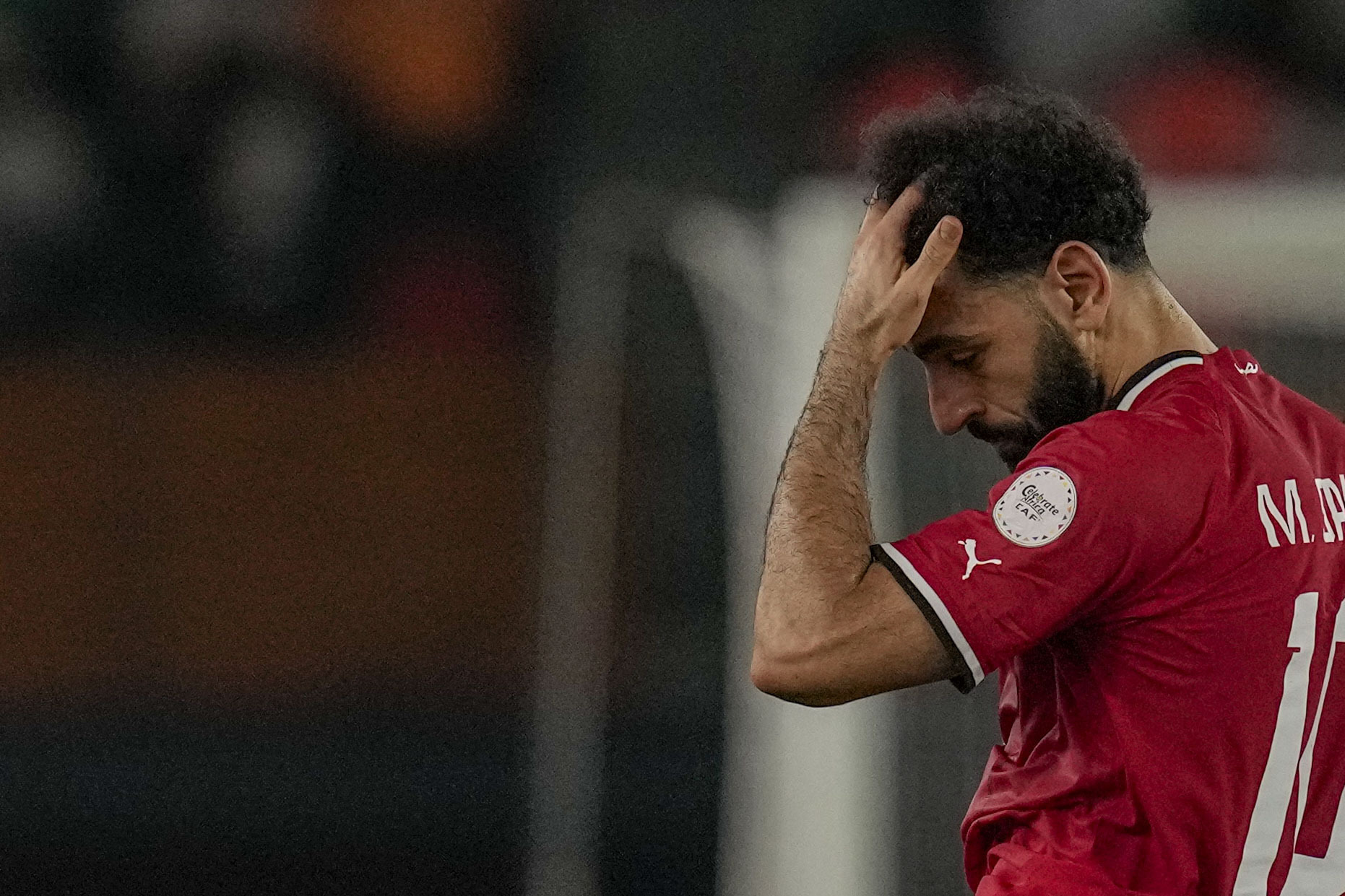 Egypt's Mohamed Salah leaves the field after sustaining an injury during the African Cup of Nations Group B soccer match between Egypt and Ghana in Abidjan, Ivory Coast, Thursday, Jan.18, 2024. (AP Photo/Themba Hadebe)