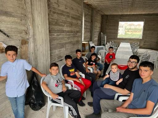 Tawfiq Ajaq, second from right, is seen with members of his large family [Courtesy of Tawfiq Ajaq‘s family]