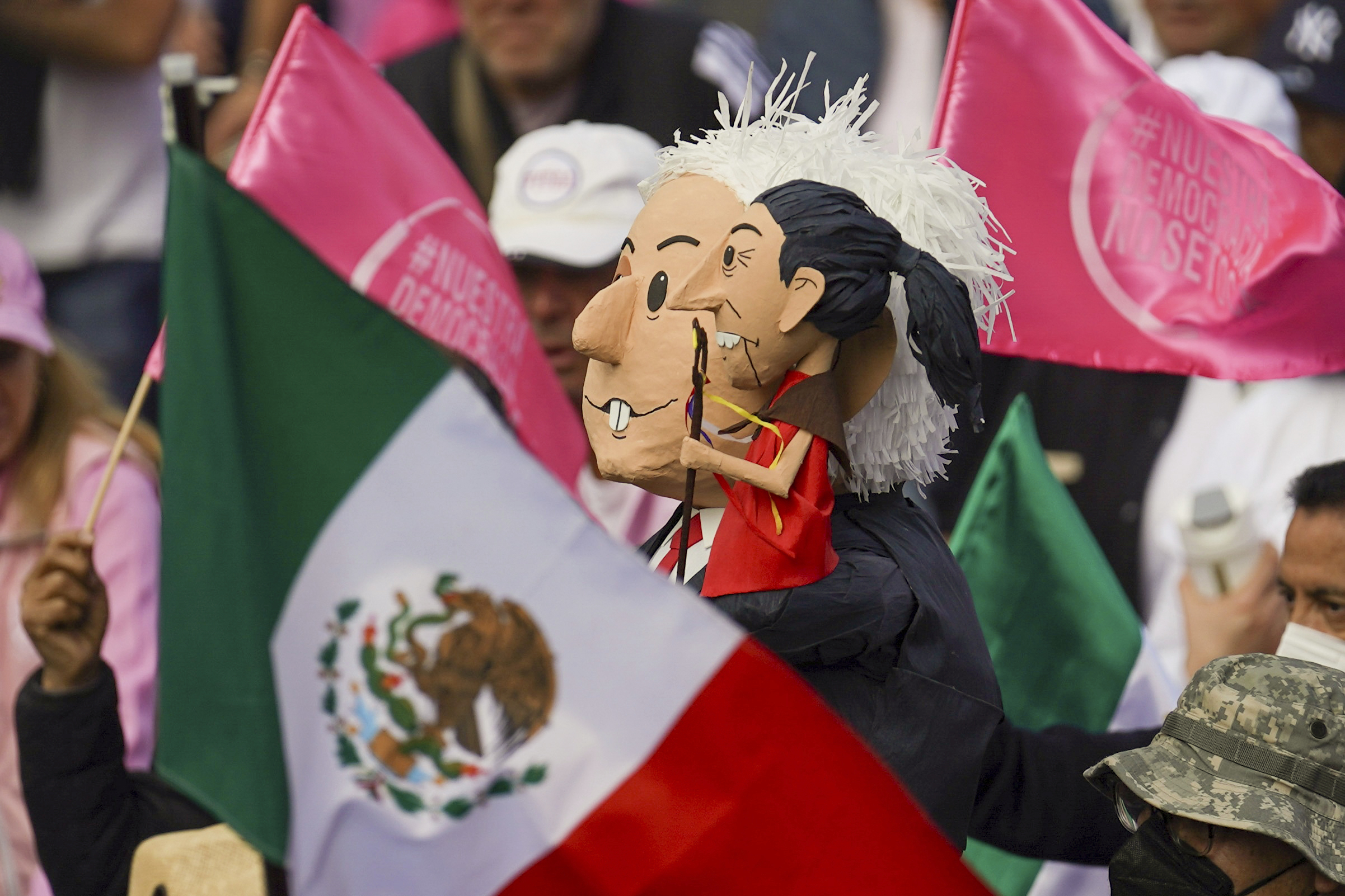 People take parte in a march organized by citizen organizations demanding that electoral autonomy be respected in the upcoming general elections in downtown Mexico City