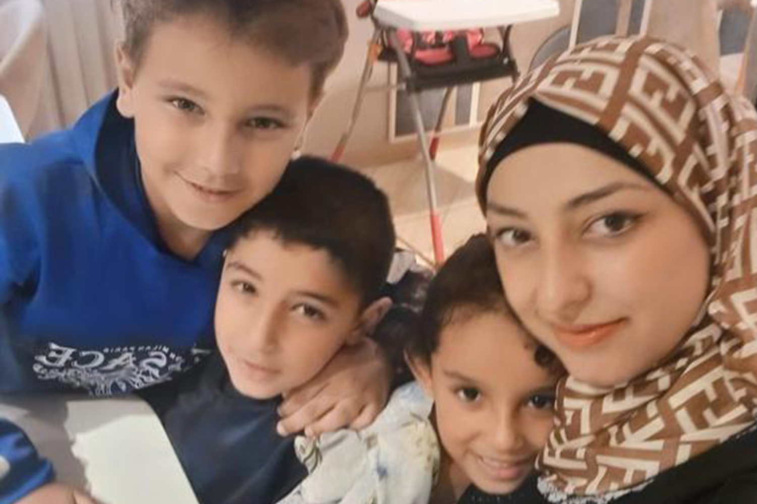 Alaa el-Qatrawi with Yamen and her twins Orchid and Kenan