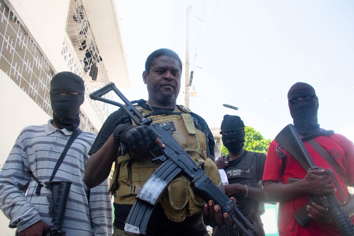 Armed gang leader Jimmy "Barbecue" Cherizier and his men are seen in Port-au-Prince