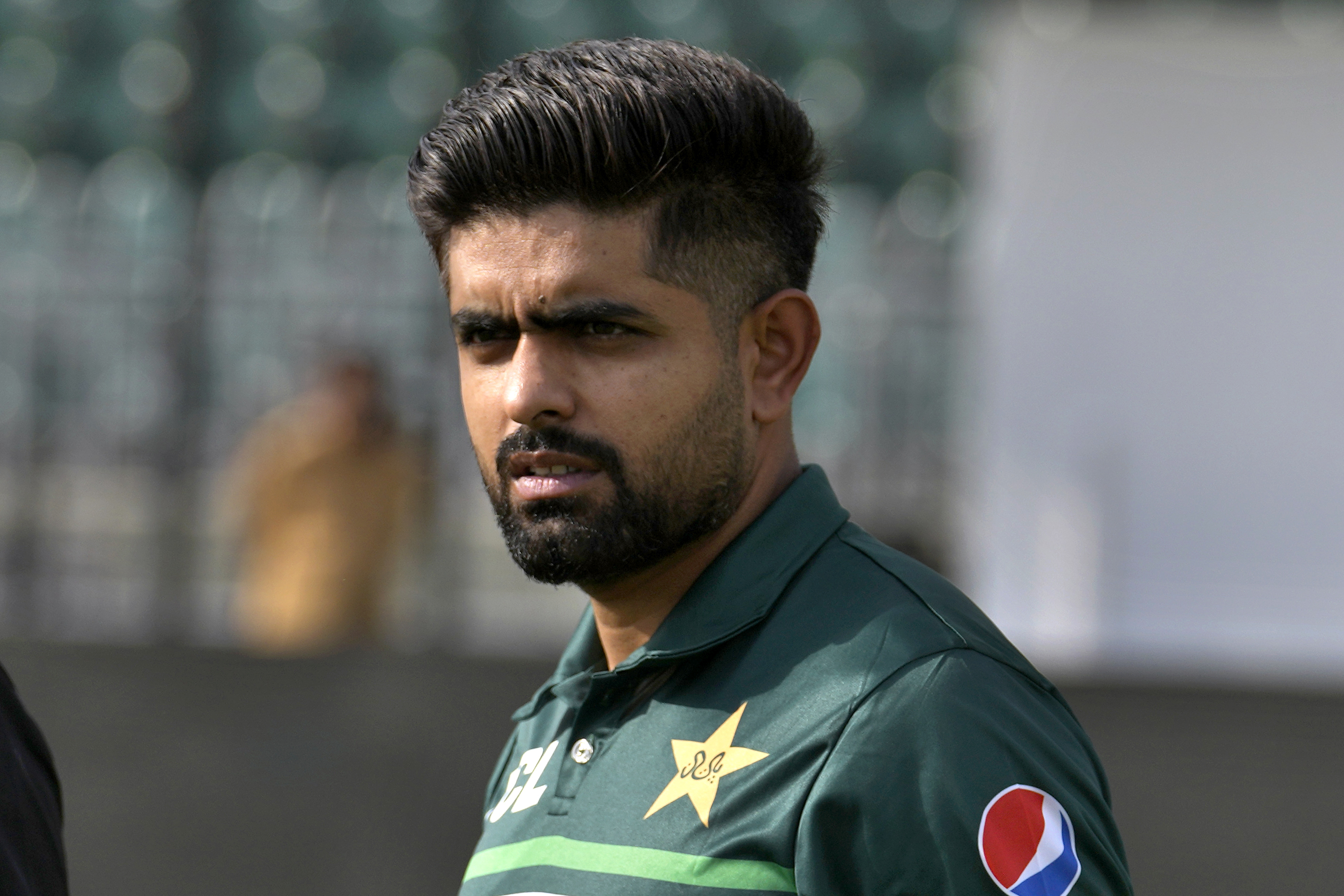 Pakistan's skipper Babar Azam walking at a one-day international cricket matches series, in Rawalpindi, Pakistan.