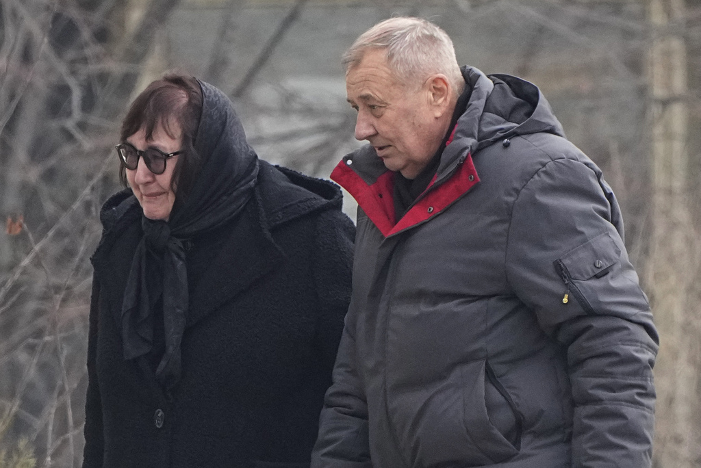 Anatoly Navalny, right, and Lyudmila Navalnaya, parents of Russian opposition leader Alexei Navalny walk to the Church of the Icon of the Mother of God Soothe My Sorrows, in Moscow, Russia