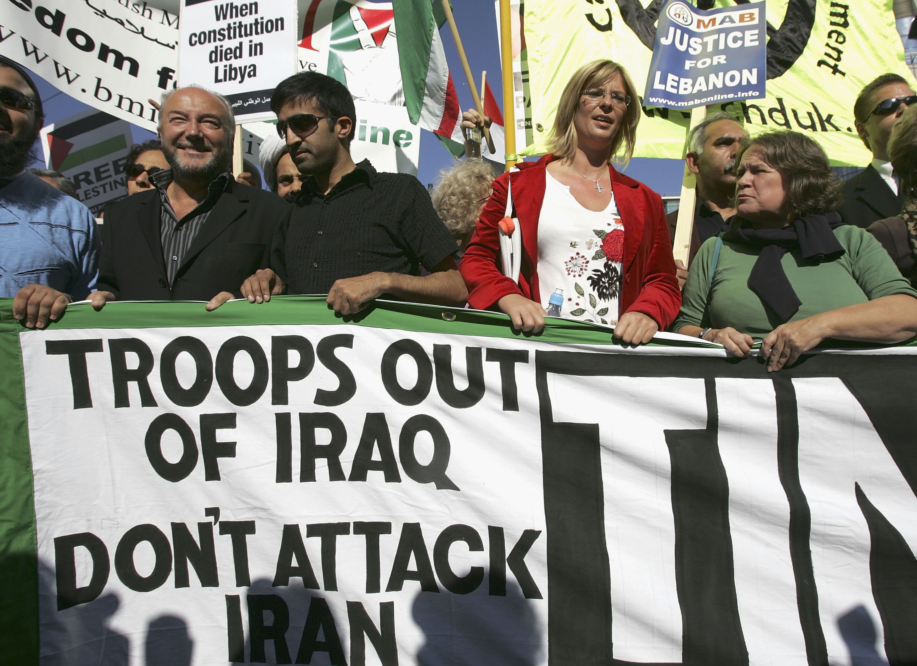 Then-Respect Party member George Galloway, left, with antiwar demonstrators in Manchester on the eve of The Labour Party Conference in September 2006