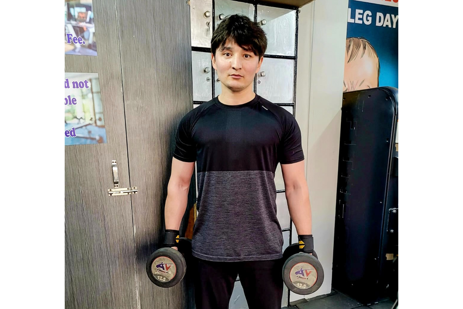 Esmatullah Asil, a former Afghan soldier at the gym in New Delhi, India, where he now works to survive in exile
