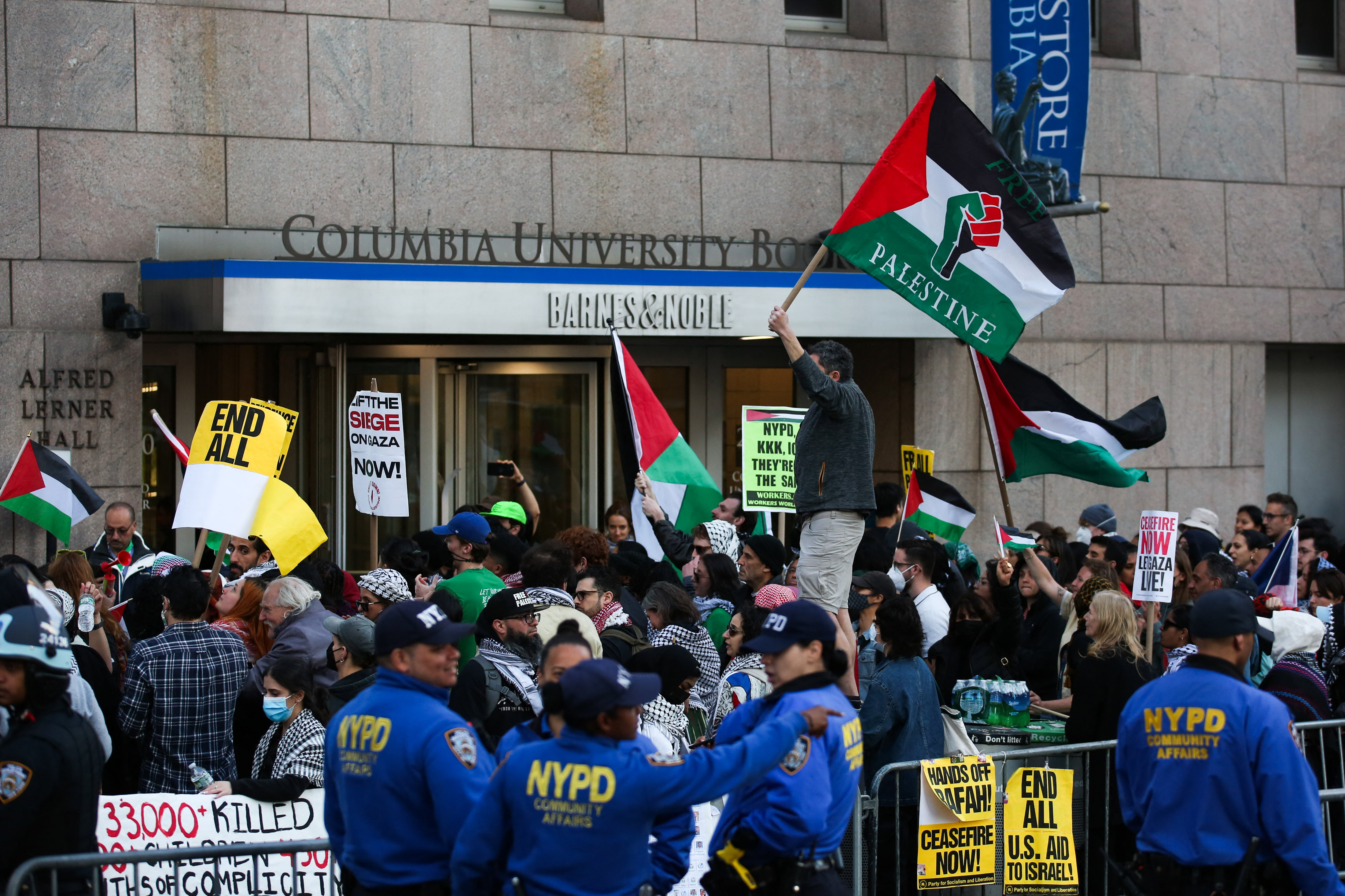 people waving palestinian flags clash with police