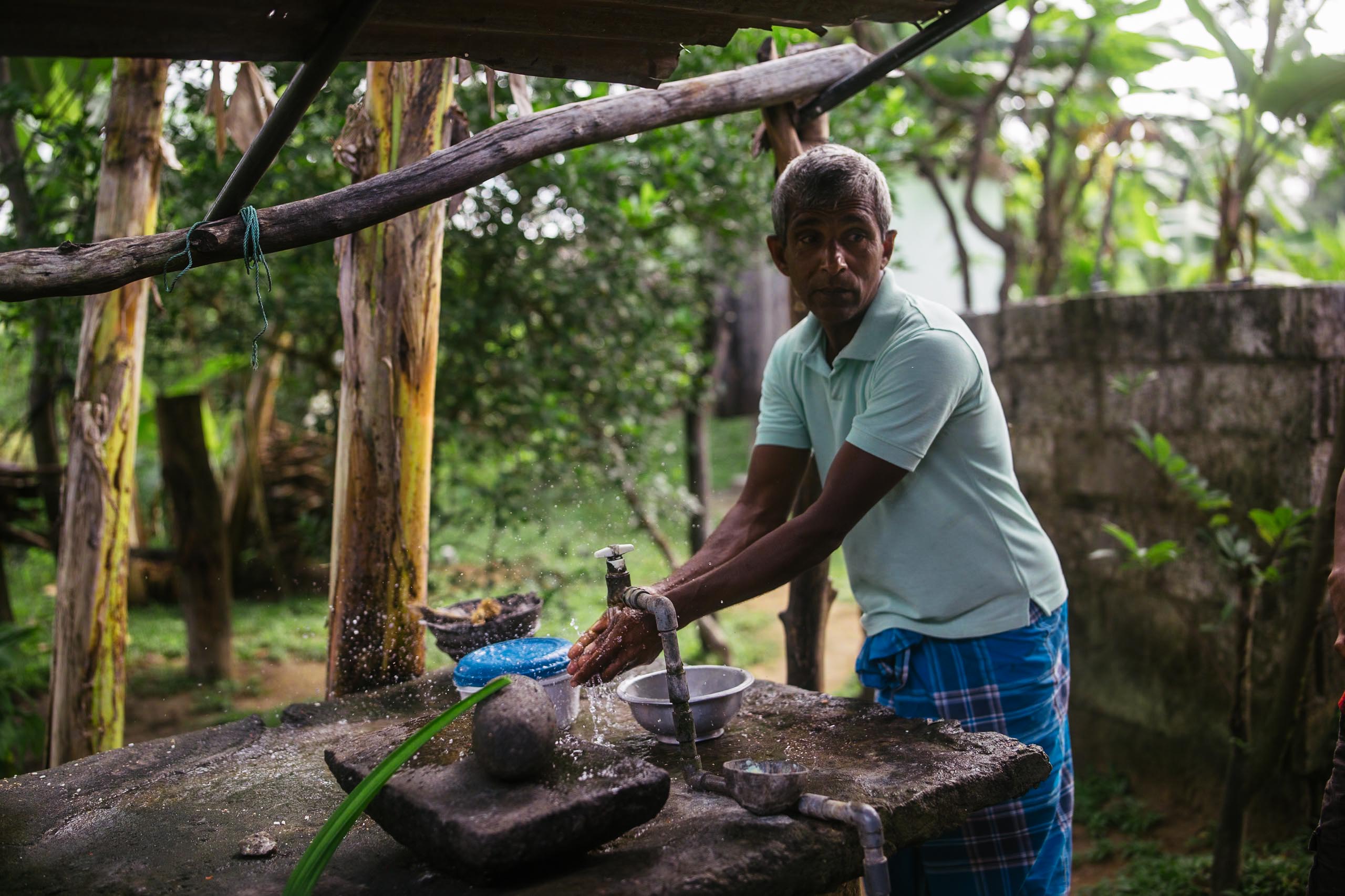 A farmer in Medirigiriya, one of Sri Lanka’s ‘hotspots’ for unexplained kidney disease cases, uses water from his ground well which sources water from very deep below the surface