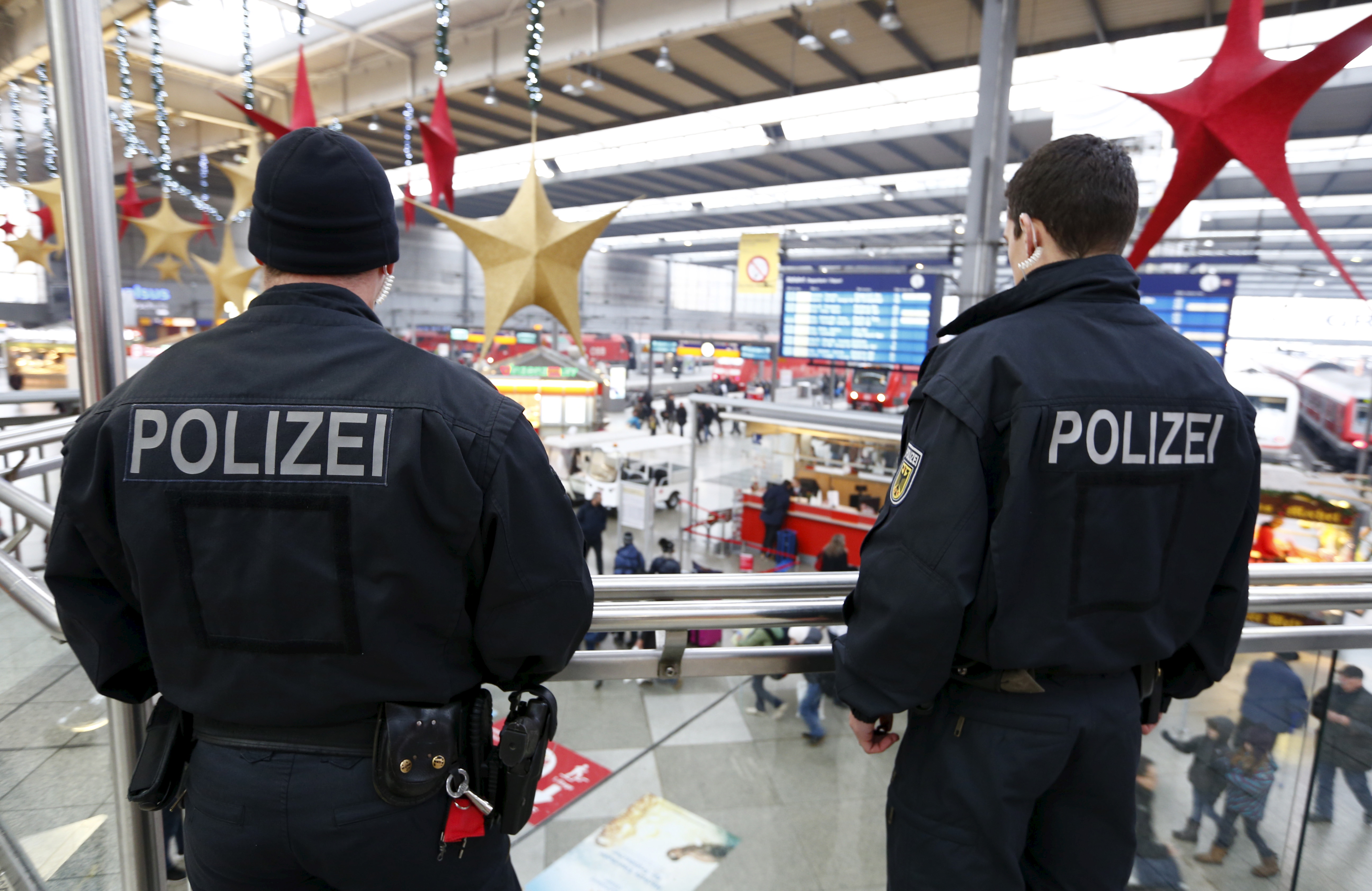 Police standing at train station.