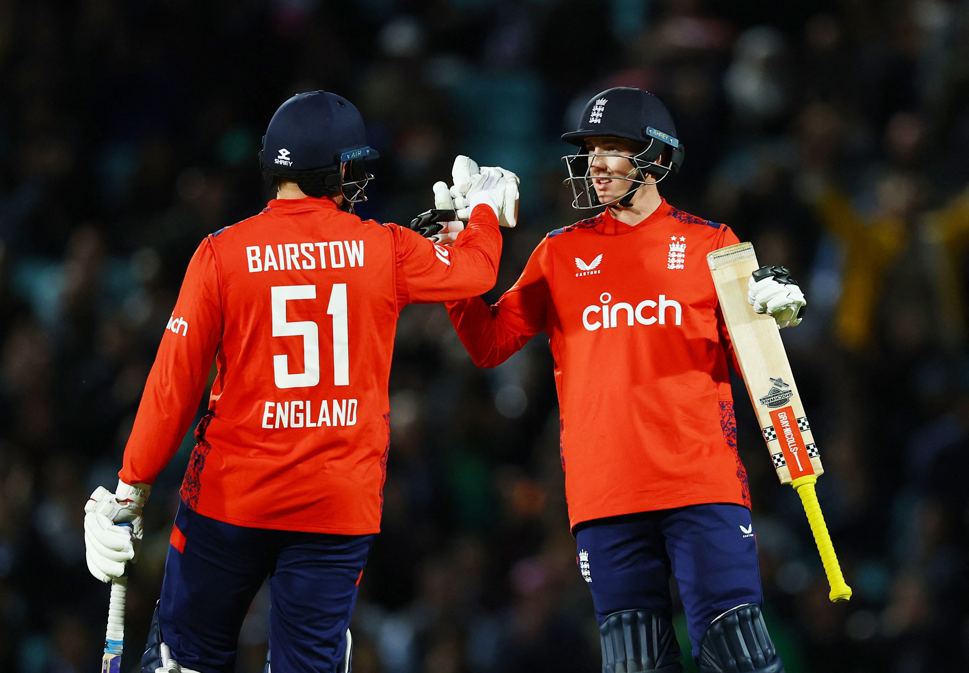 England's Jonny Bairstow celebrates winning the game with Harry Brook