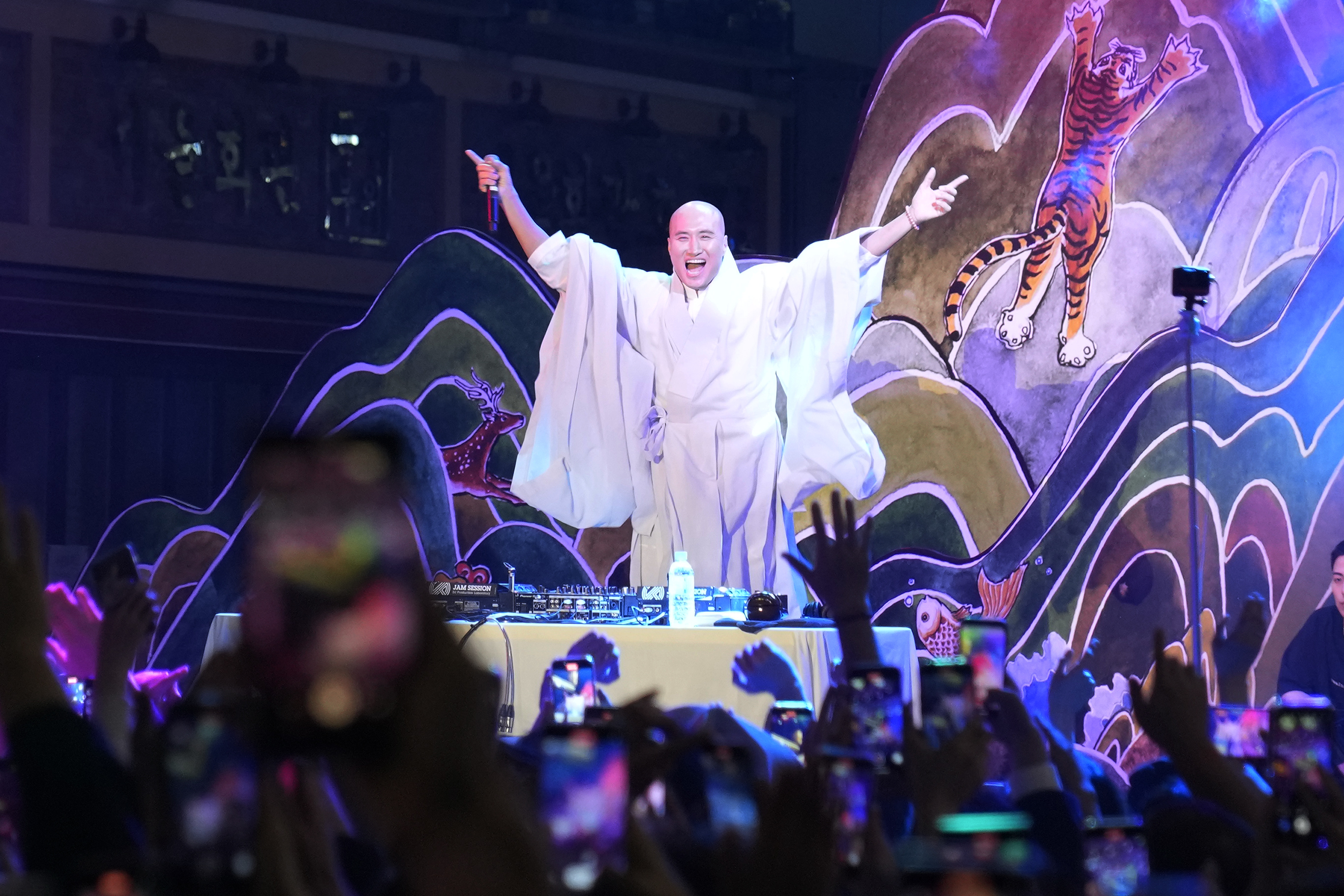 NewJeansNim, a comedian and DJ whose real name is Youn Sung-ho, performs at an annual lantern-lighting festival dressed up as a monk, in Seoul, South Korea, on May 12, 2024