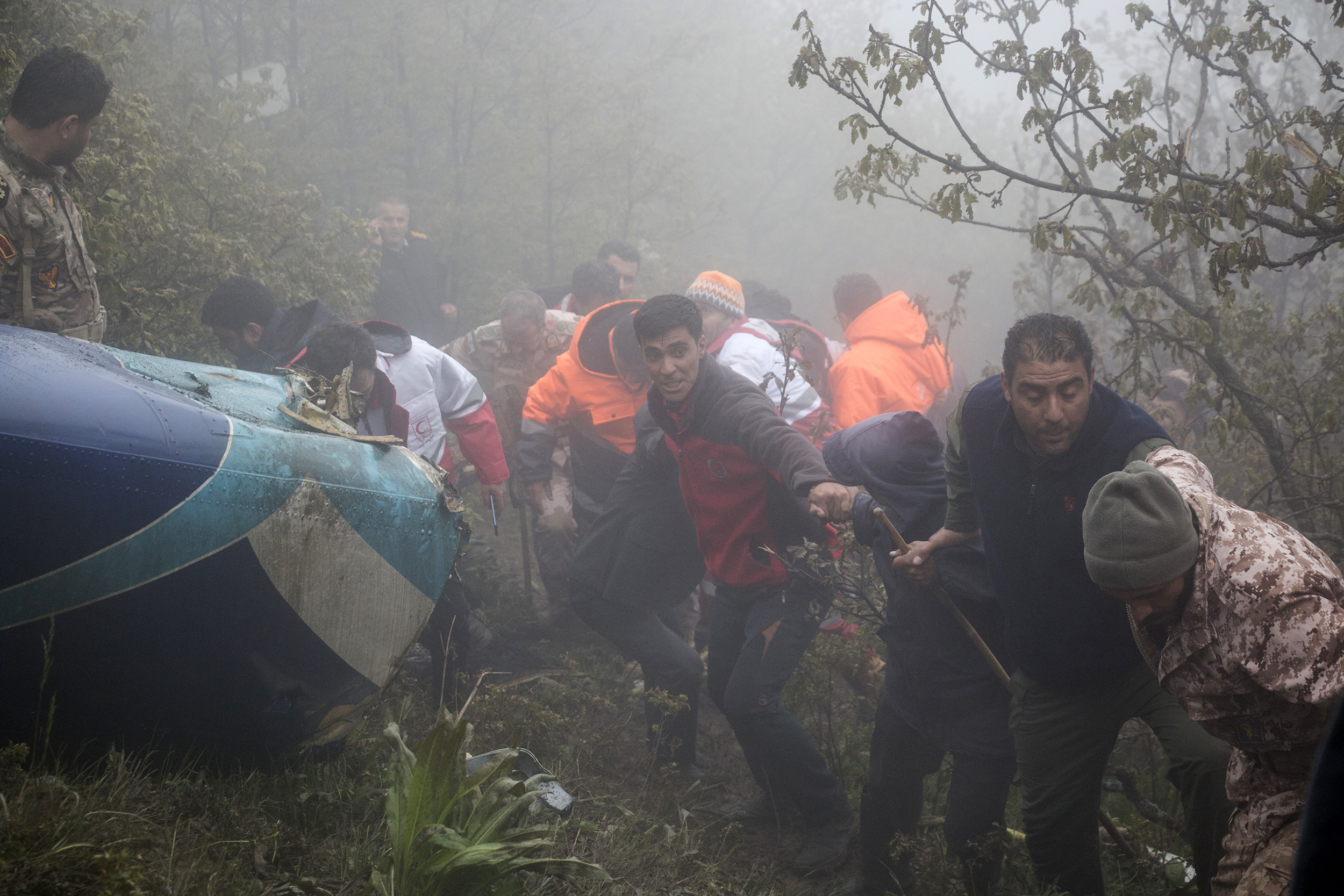 Rescue team carry a body