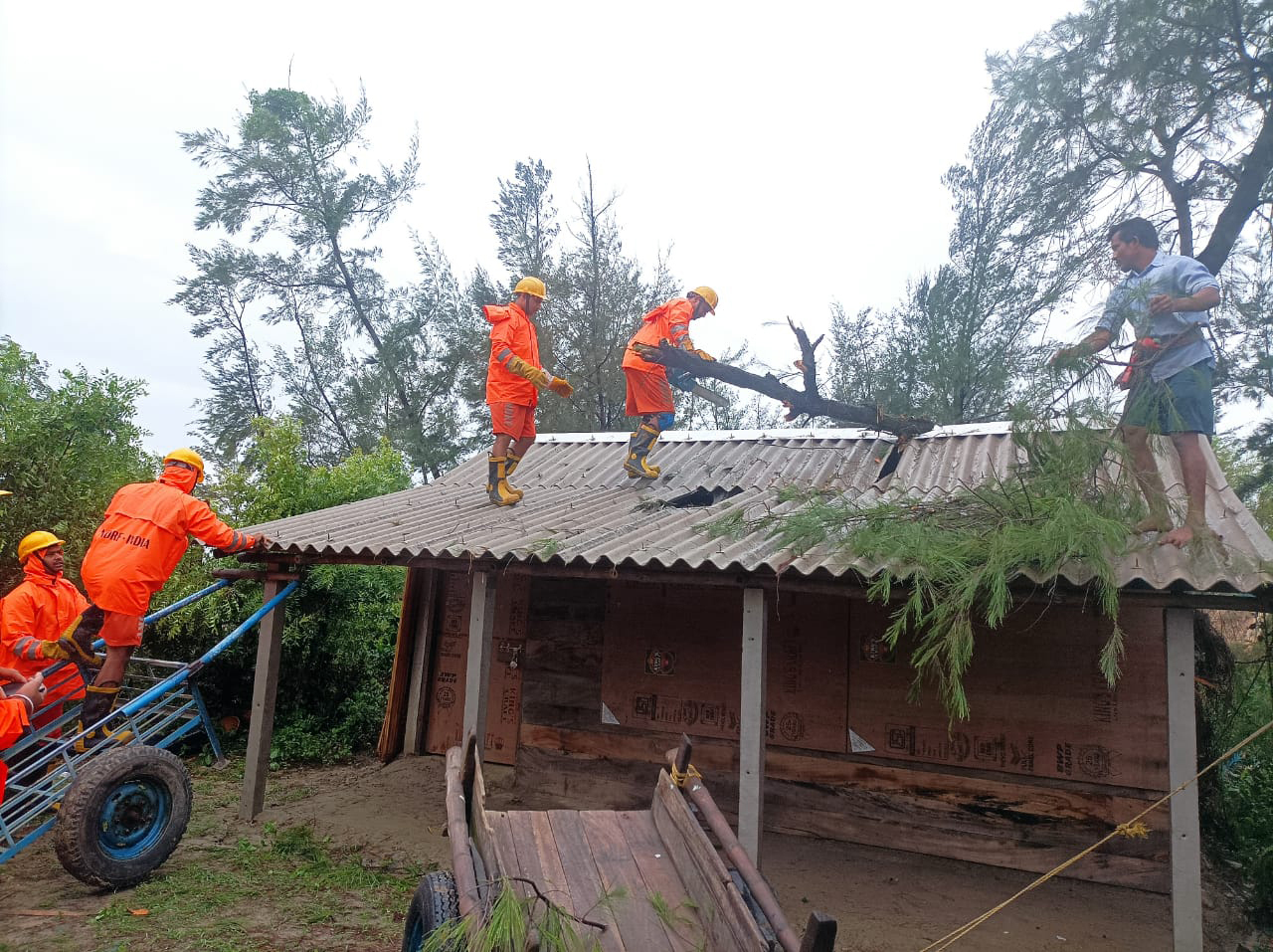 Cyclone blows away thatched roofs and cuts power in Bangladesh and India