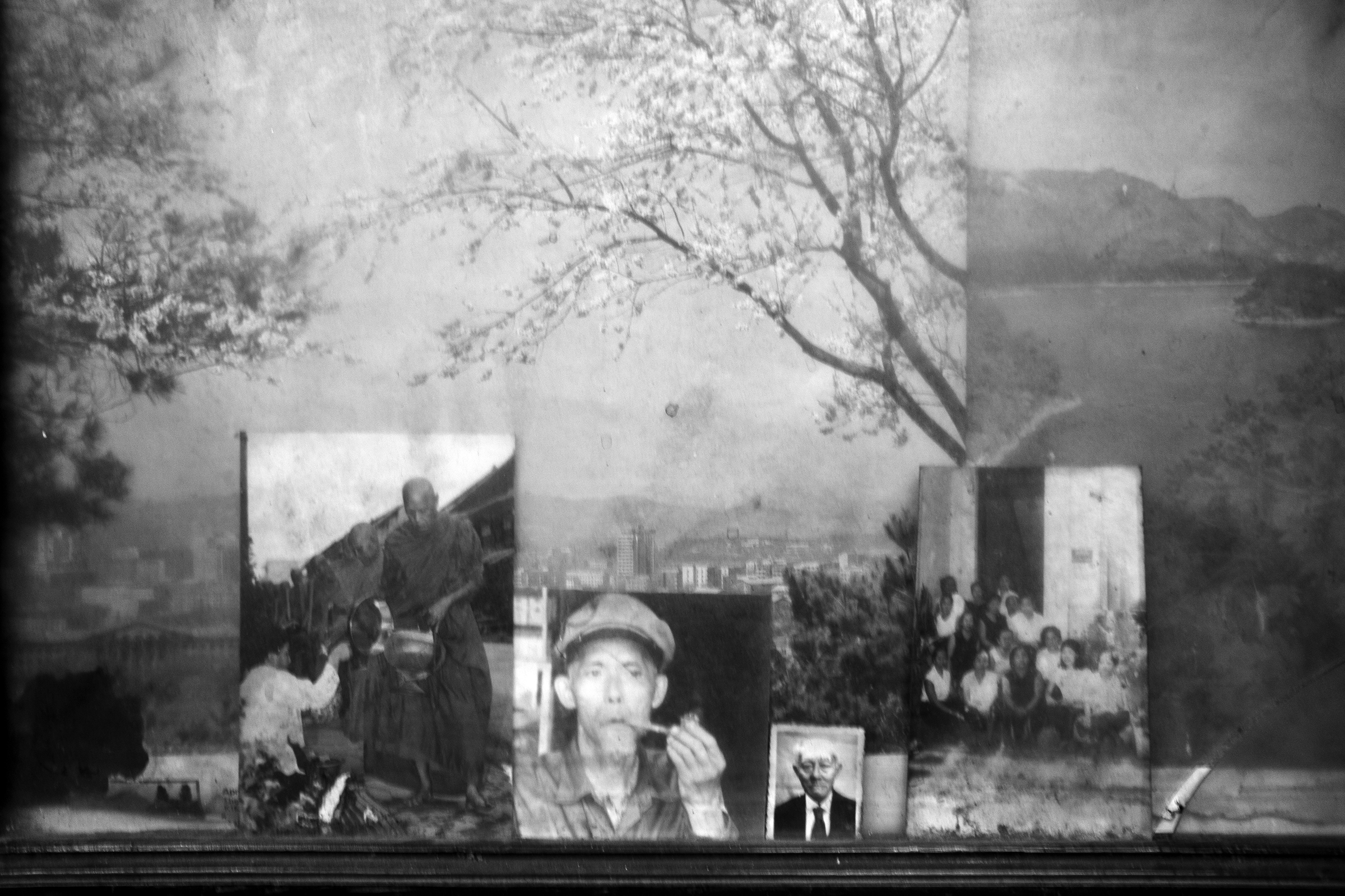 A shop window displays old photographs in the centre of the old town of Luang Prabang