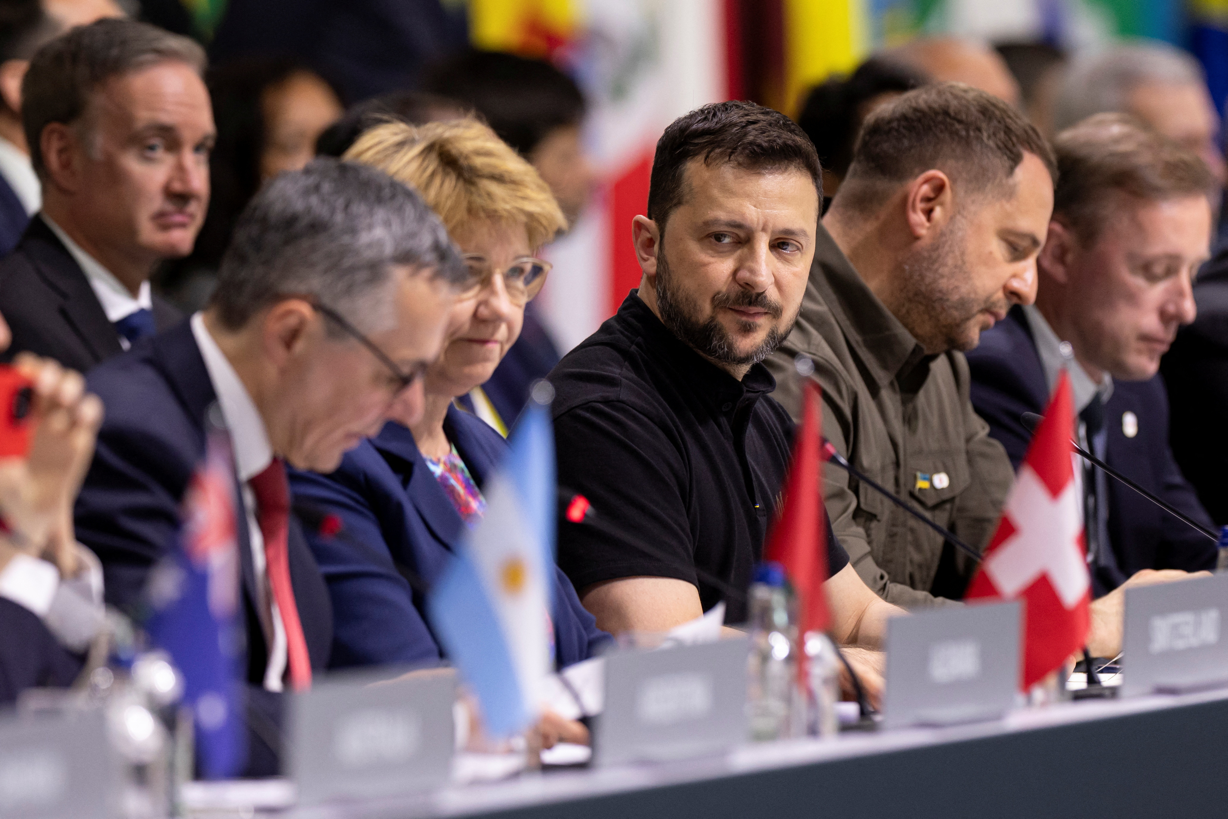 Ukrainian President Volodymyr Zelenskiy reacts next to Swiss Federal Councillor Ignazio Cassis, Swiss Federal President Viola Amherd, Head of the Presidential Office of Ukraine Andriy Yermak, U.S. Security Advisor Jake Sullivan, during the plenary session, during the Summit on Peace in Ukraine, in Stansstad near Lucerne, Switzerland, Sunday, June 16, 2024. Michael Buholzer/Pool via REUTERS