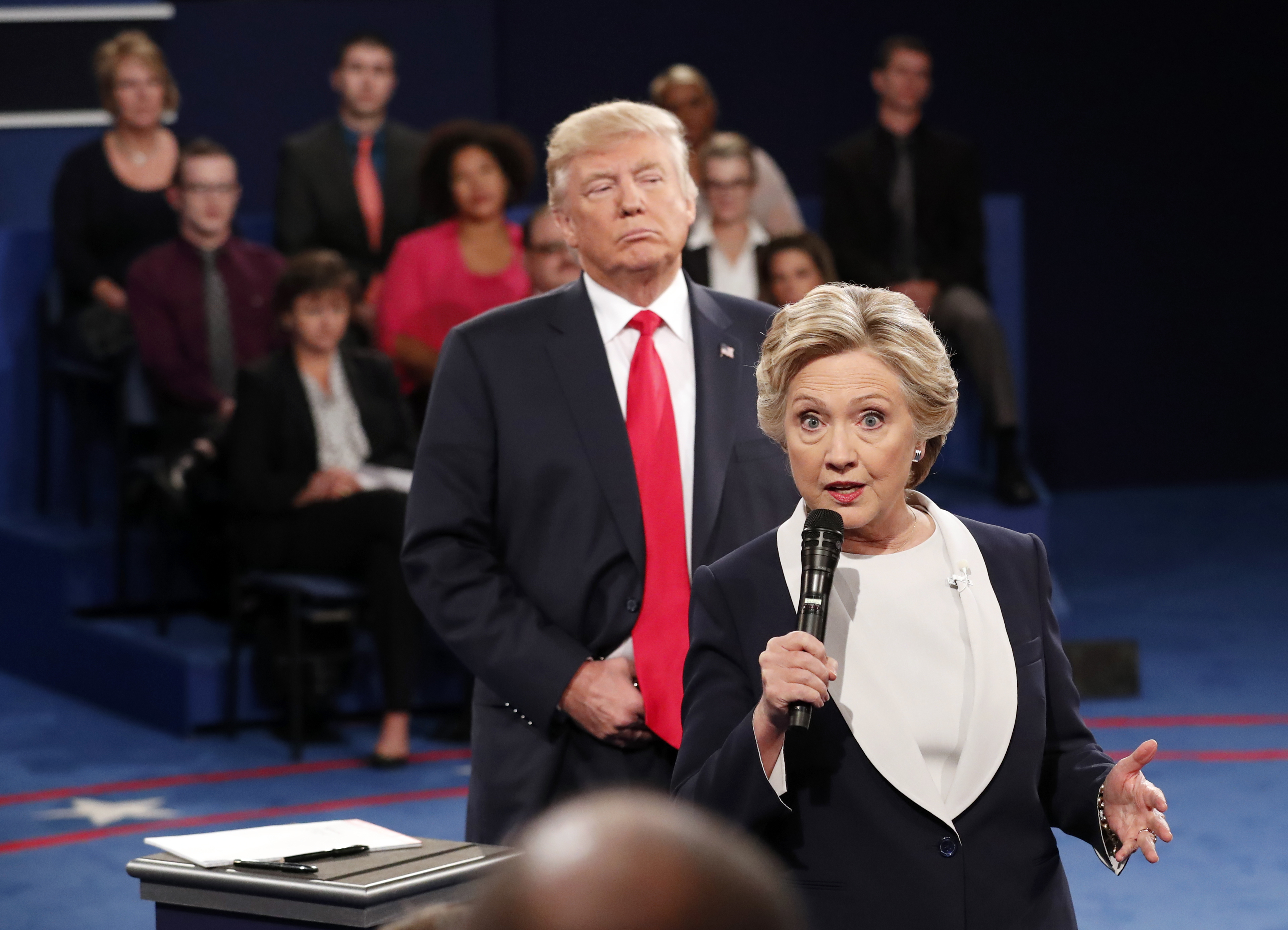 Trump looms over Democratic presidential nominee Hillary Clinton during the 2016 debate