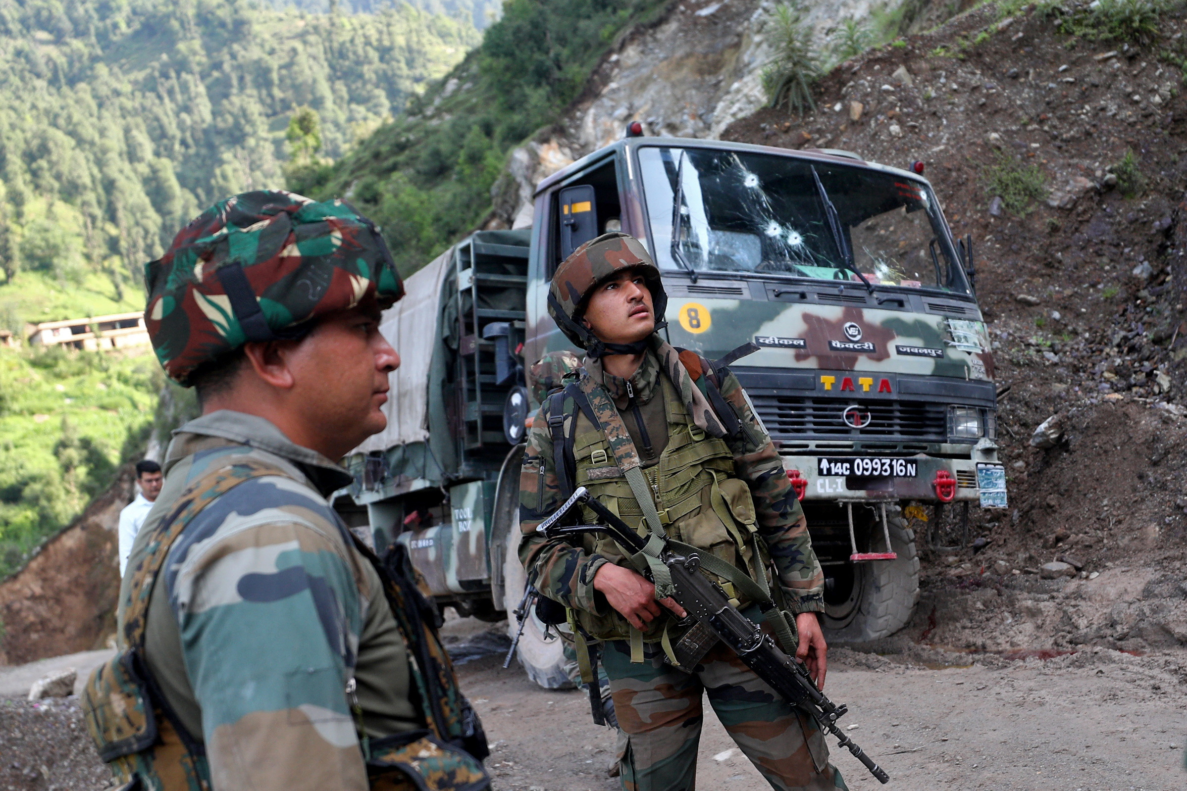 Troops survey the area after an attack on an Indian Army convoy in Kathua district of Jammu and Kashmir last week