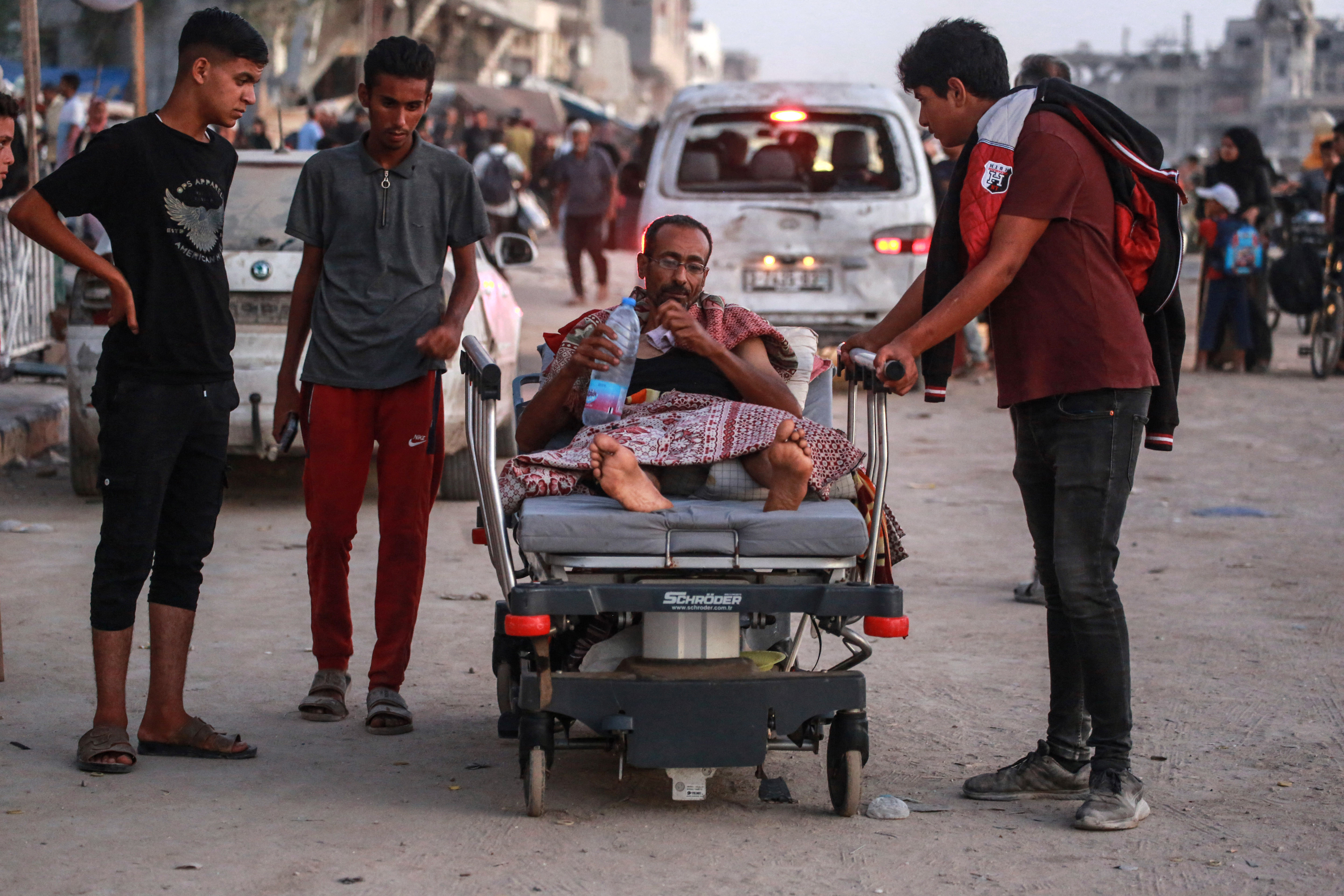 Displaced Palestinians leave an area in east Khan Younis