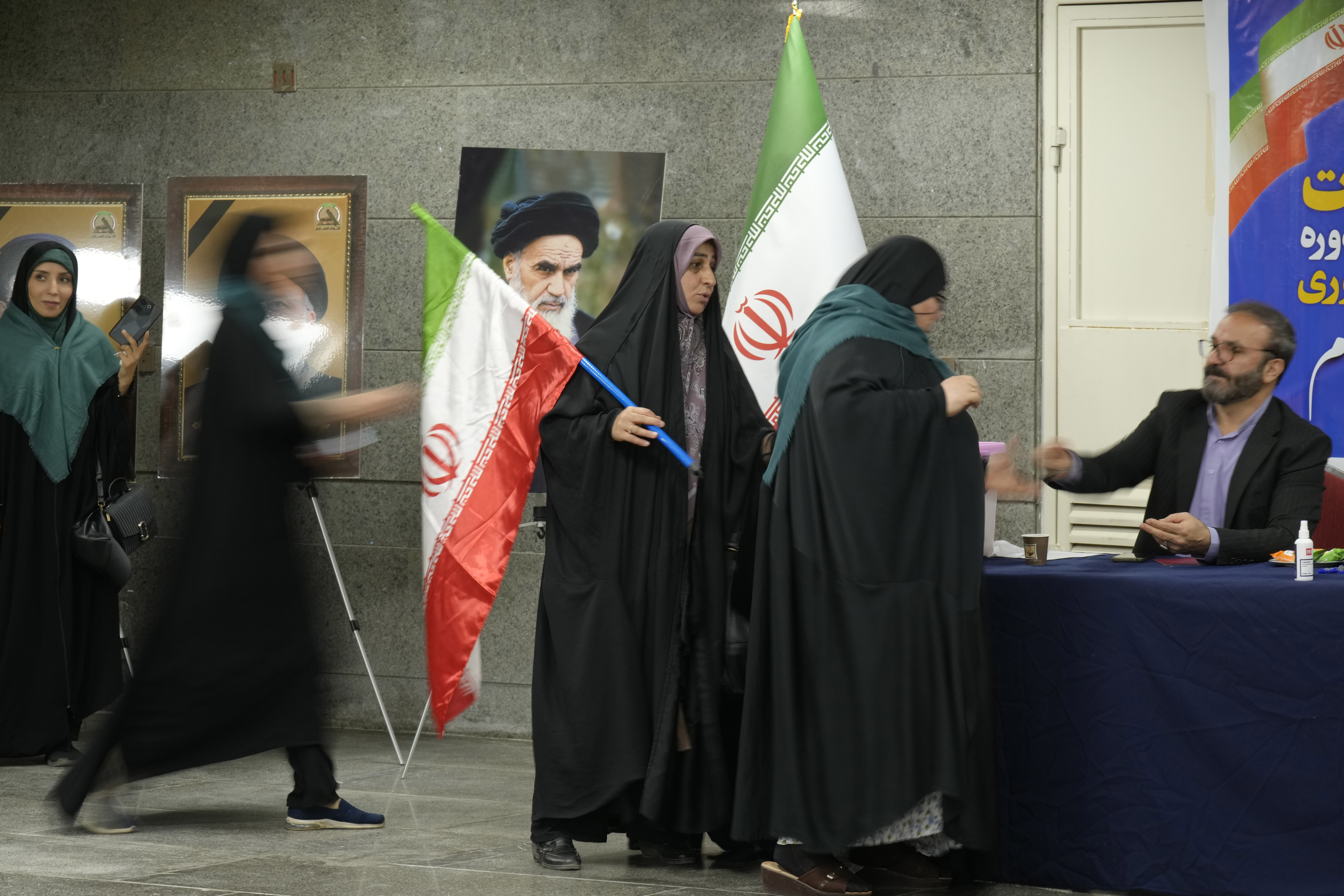 Iranians cast their votes at a polling station inside Iran’s embassy in Baghdad, Iraq, on July 5, 2024