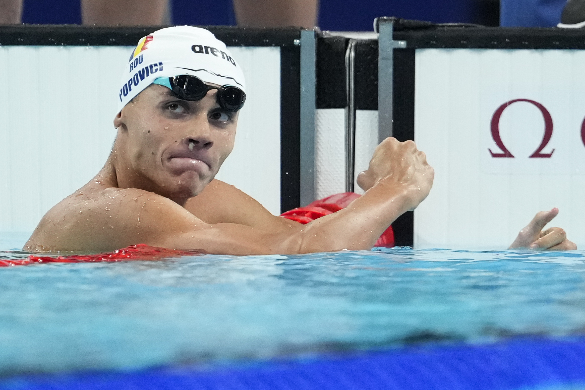 Romania’s David Popovici beat Britain’s Matthew Richards by 0.02 of a second to win the men’s 200m freestyle gold medal