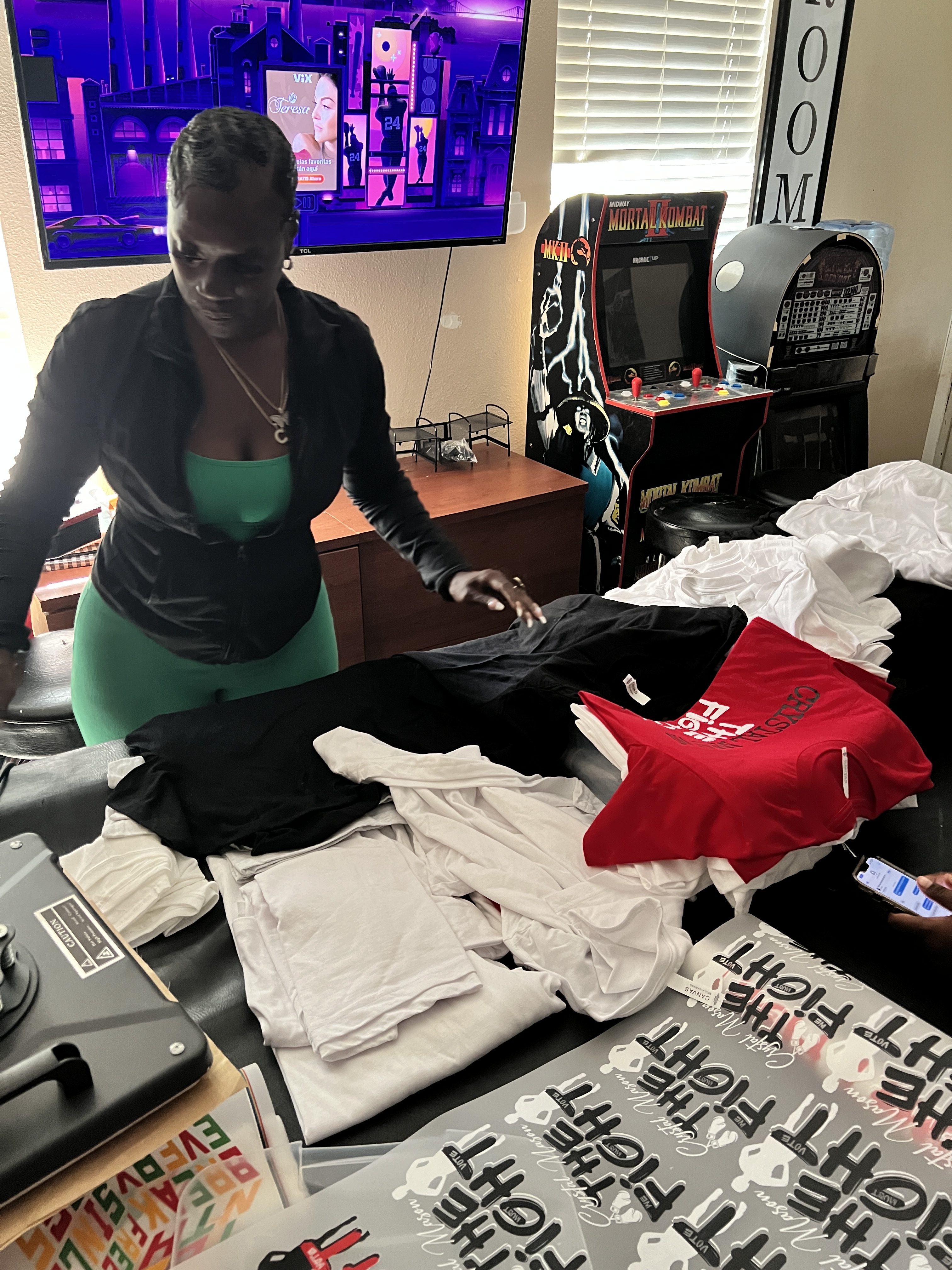 Crystal Mason prepares T-shirts for her eponymous organisation, which promotes voting rights