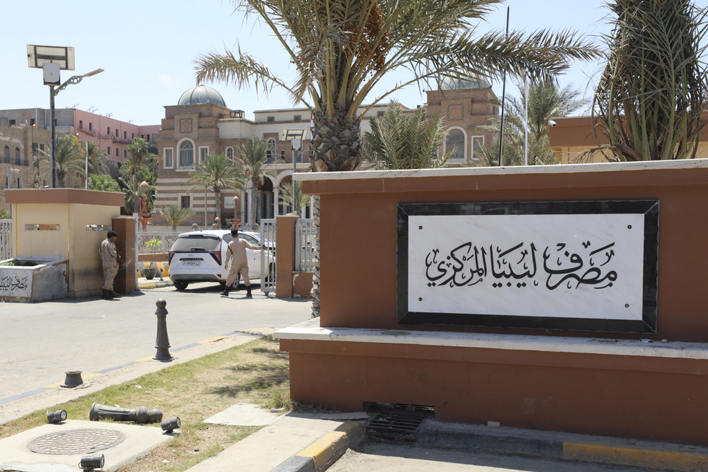 Soldiers guard the gate of the Central Bank of Libya in Tripoli, on August 27, 2024