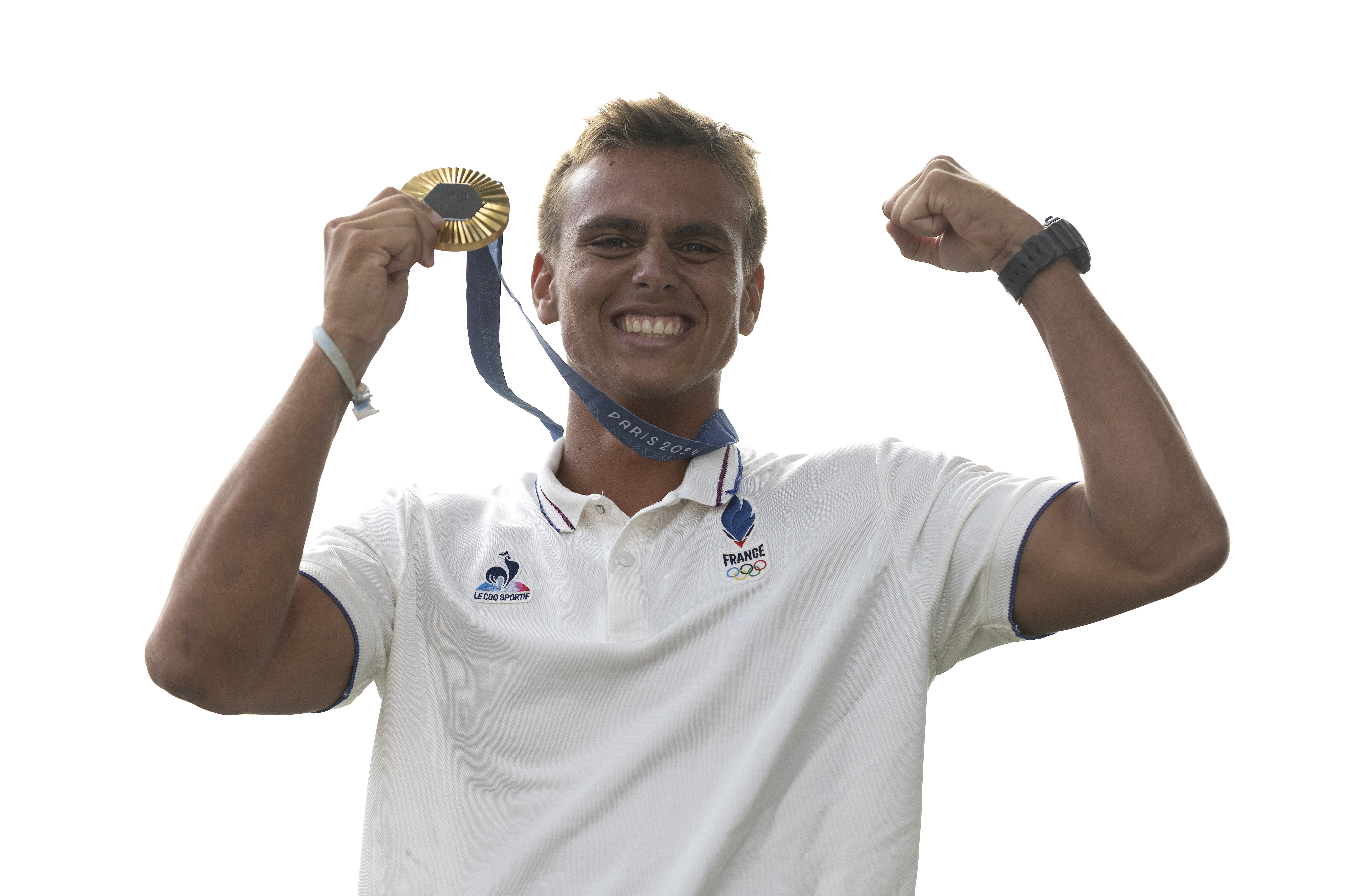 Gold medallist Kauli Vaast of Team France poses on the podium during the men’s surfing medal ceremony