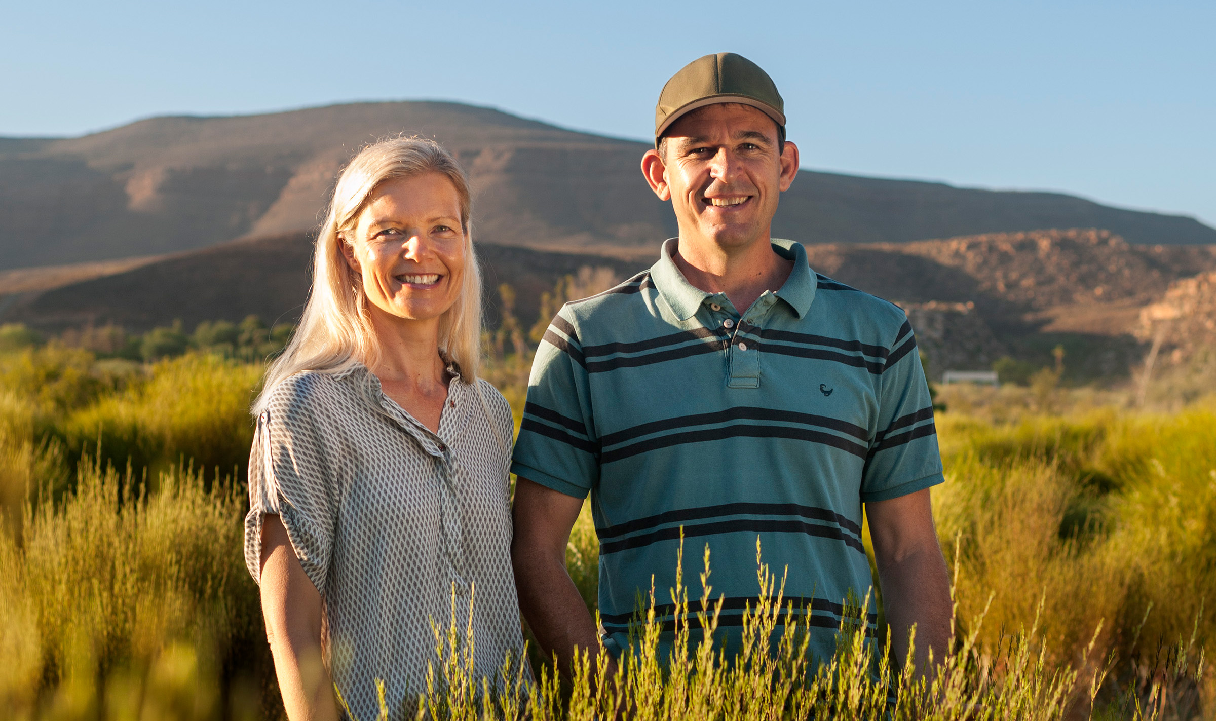 Red Espresso founders Pete and Monique Ethelston in the tea lands where rooibos is grown [Courtesy of Red Espresso]