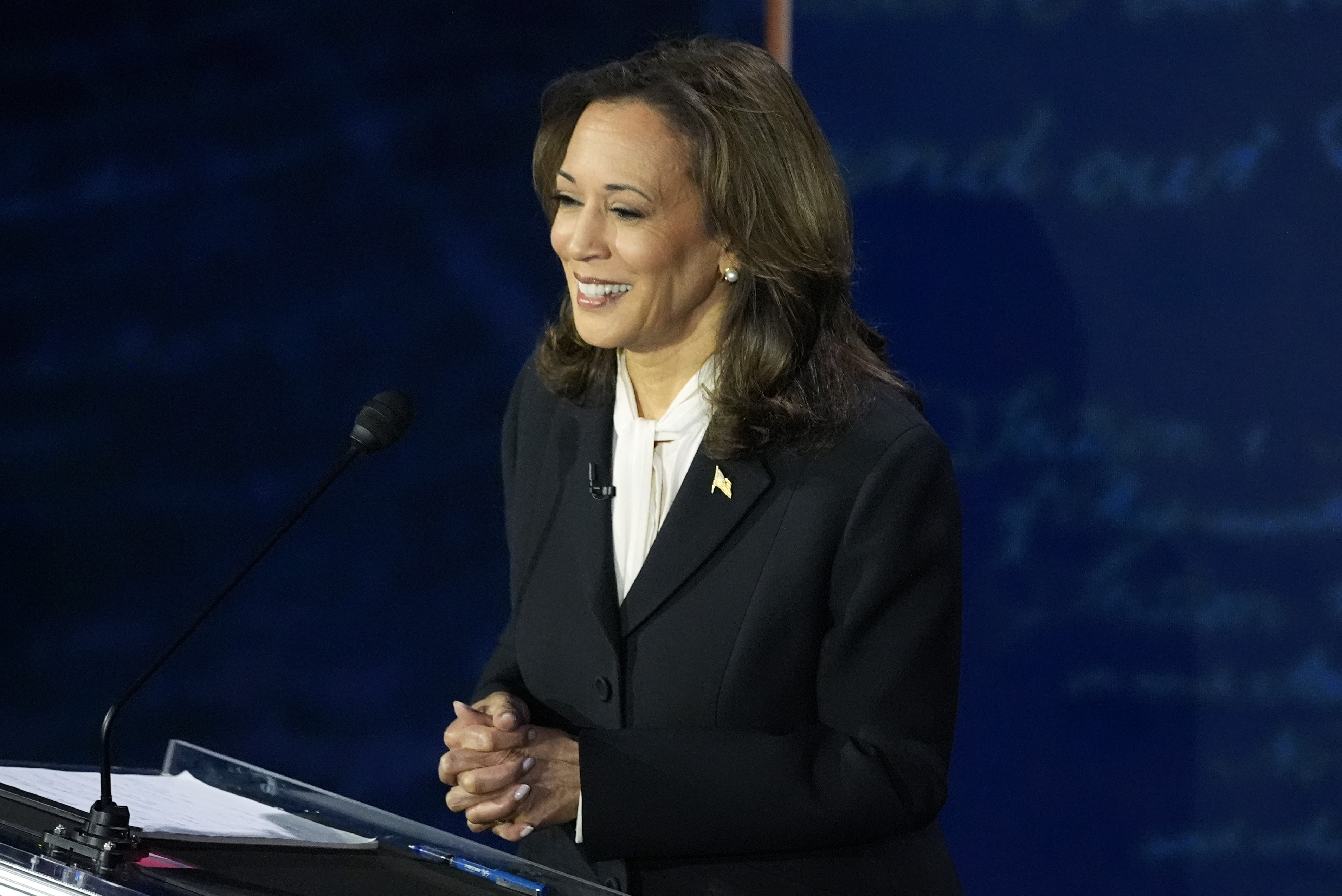 Kamala Harris listens and smiles during the debate in Philadelphia, Pennsylvania