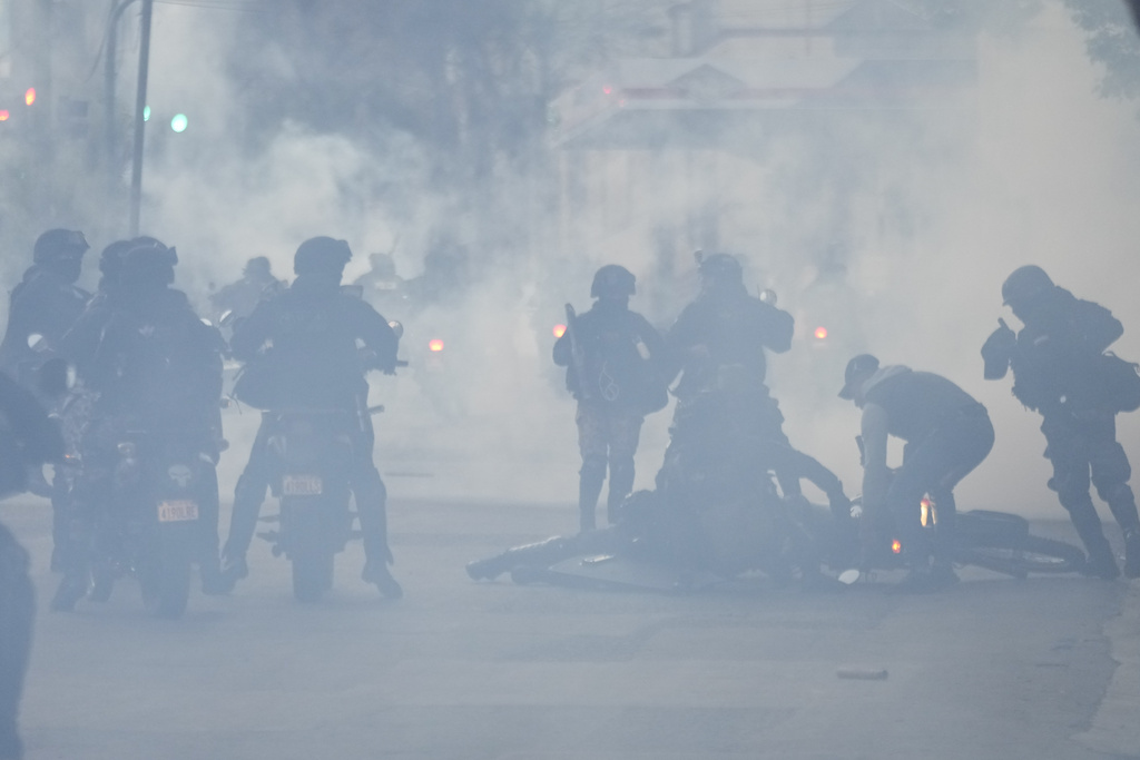 Police throw gas at supporters of former President Evo Morales