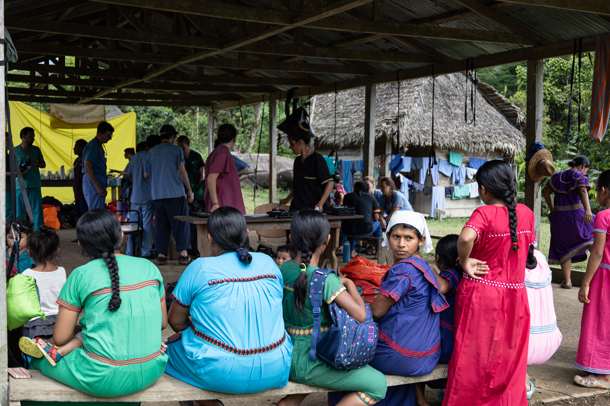 Ngabe-Bugle women, wearing traditional nagua dresses, wait to be seen at the Floating Doctors clinic in La Sabana, Panama