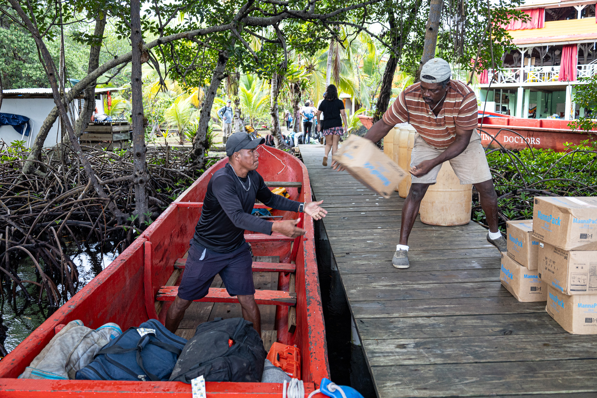 Floating Doctors team members load up boats with medical equipment and dry food ahead of a visit to the village of La Sabana in Panama