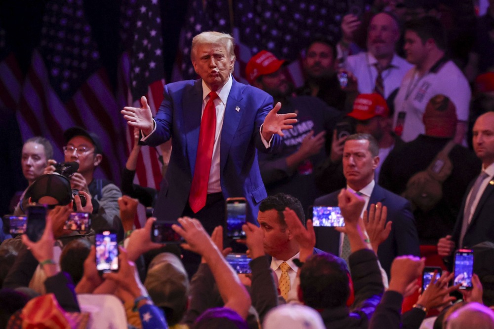 Republican presidential candidate and former US President Donald Trump departs following a rally at Madison Square Garden in New York City on October 27