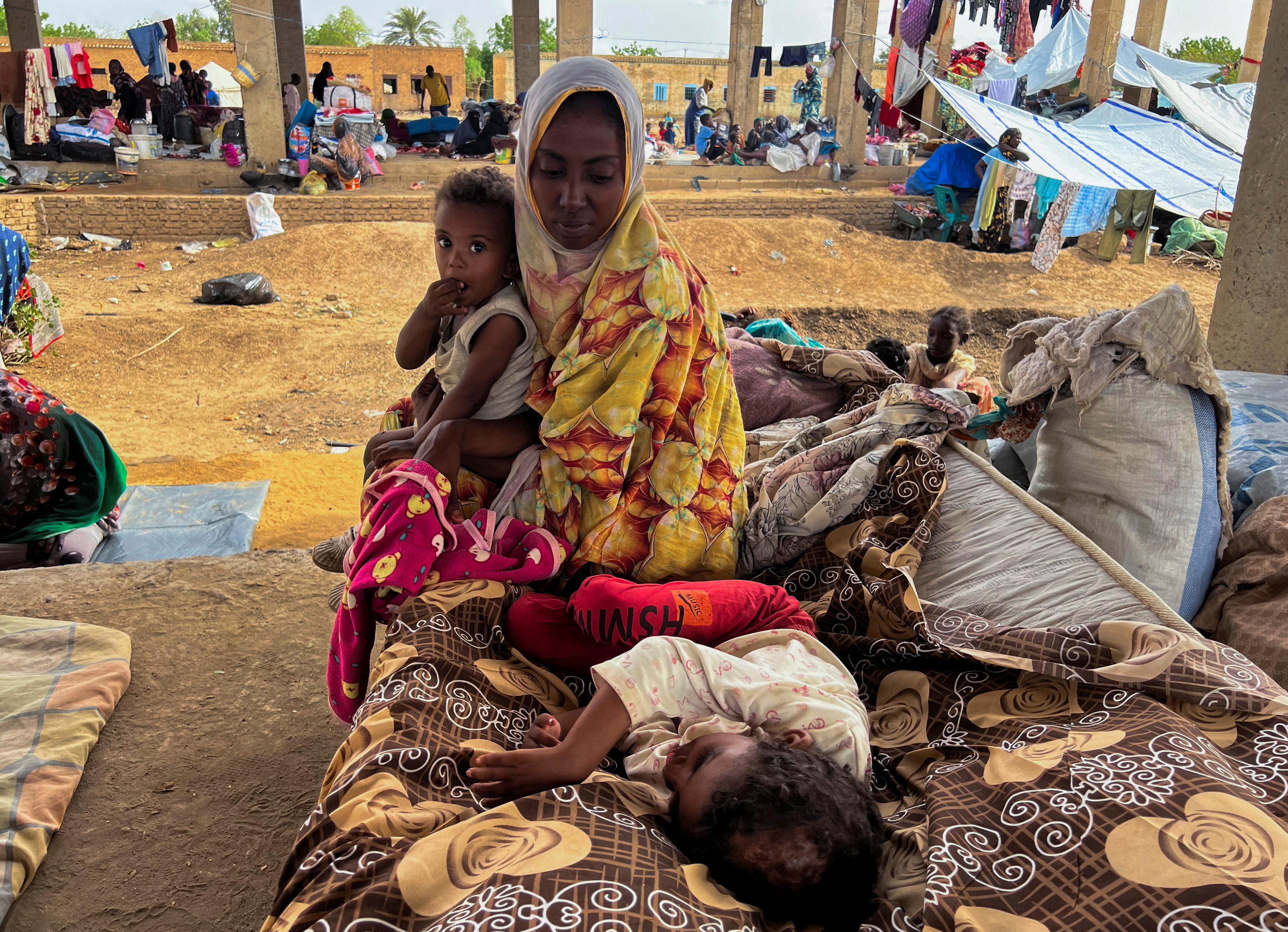 Families take shelter at a displacement site
