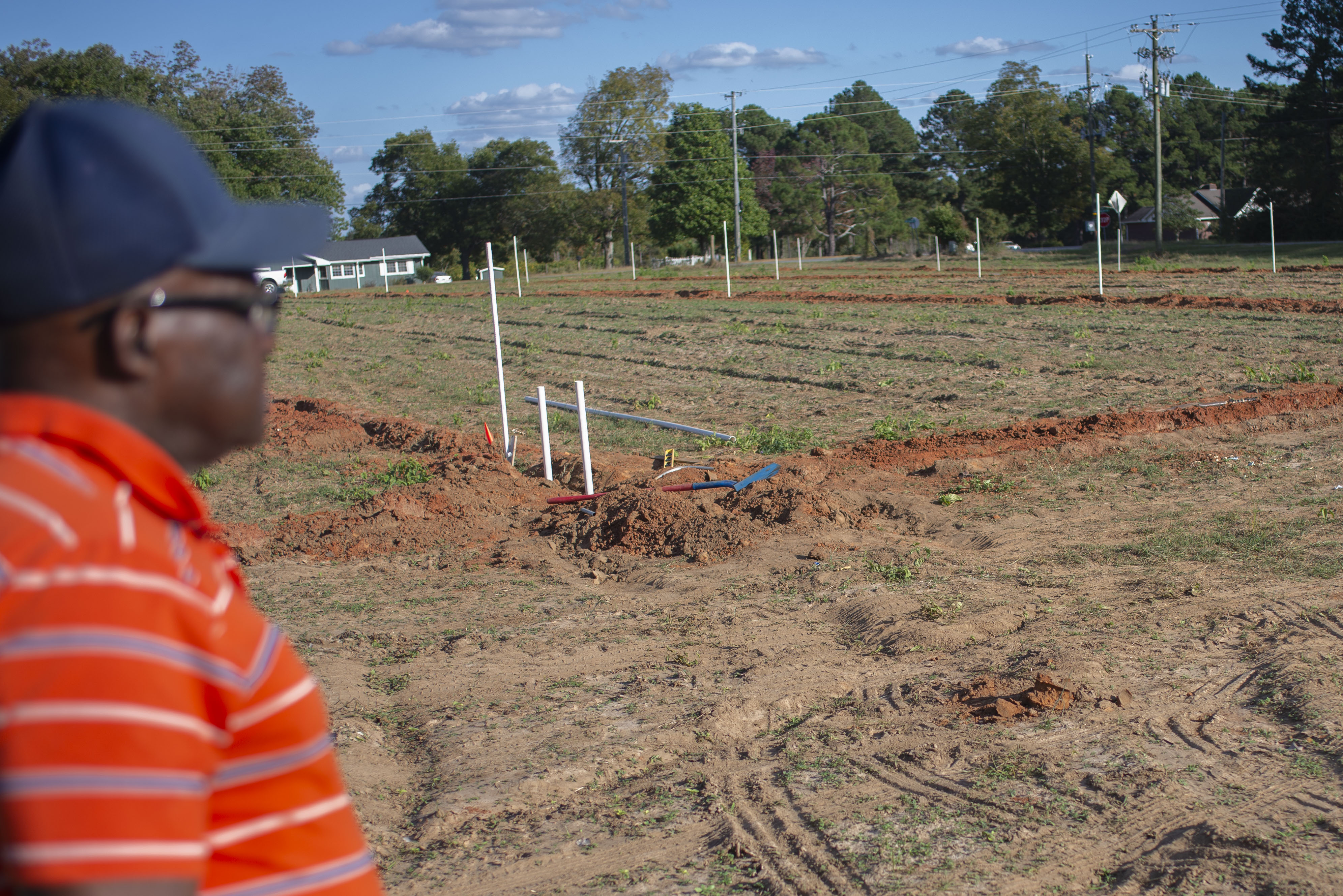 Curtis Plant surveys his farm in Peach County, Georgia