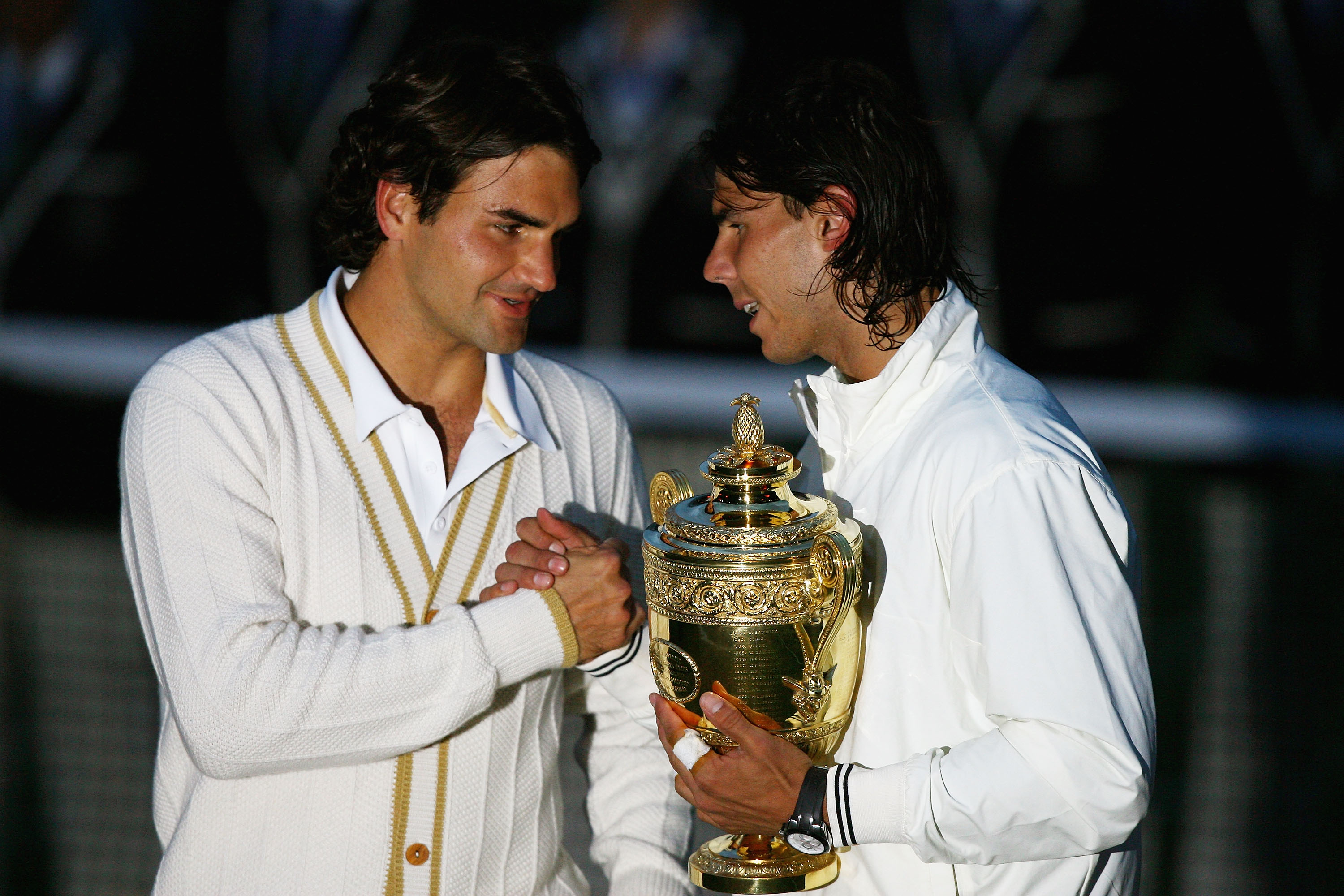 LONDON - JULY 06: Roger Federer of Switzerland congratulates Rafael Nadal of Spain in winning the Championship trophy during the men's singles Final on day thirteen of the Wimbledon Lawn Tennis Championships at the All England Lawn Tennis and Croquet Club on July 6, 2008 in London, England. (Photo by Julian Finney/Getty Images)