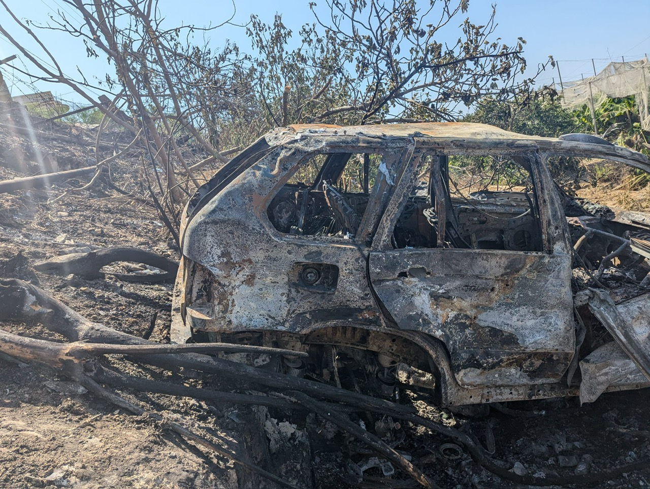 What remains of the silver BMW that was targeted
