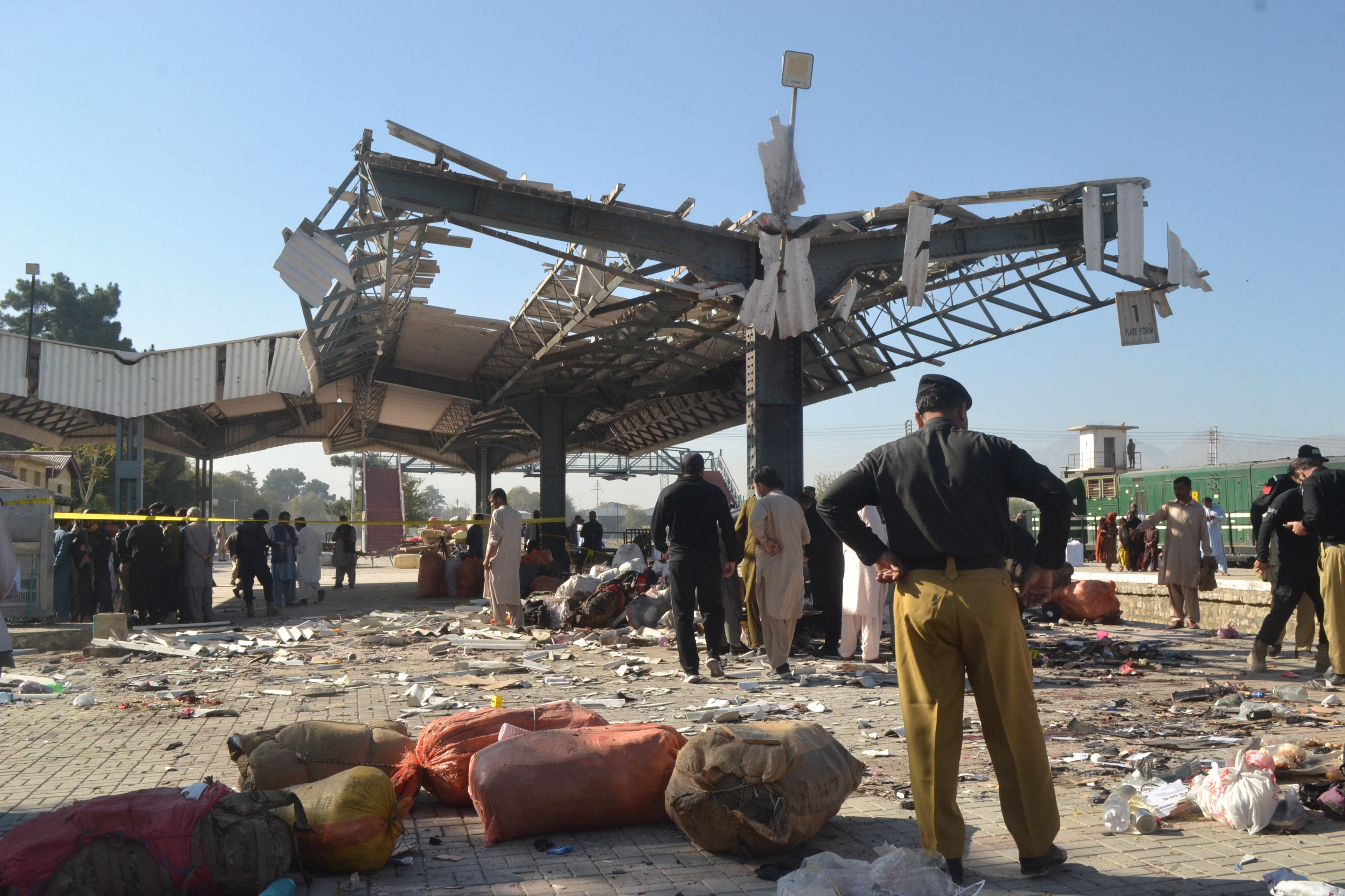 epa11710826 Pakistani security officials inspect the scene of a blast at a railway station in Quetta, the provincial capital of restive Balochistan province, Pakistan, 09 November 2024. An explosion at the Quetta Railway Station early morning has left at least 21 people dead and over 50 injured, with reports indicating a potential suicide bombing as the cause, police said. The blast occurred on the platform as passengers prepared to board the Jaffar Express for Peshawar. Emergency services quickly responded, transporting victims to Civil Hospital Quetta, where an emergency was declared to handle the influx of casualties, including women and children. Balochistan Chief Minister Sarfraz Bugti condemned the attack as a horrific act against civilians and ordered an immediate investigation, while police and bomb disposal teams secured the area for further examination. EPA-EFE/SAMI KHAN