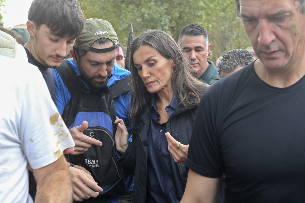 Spain’s Queen Letizia speaks with people affected by the floods