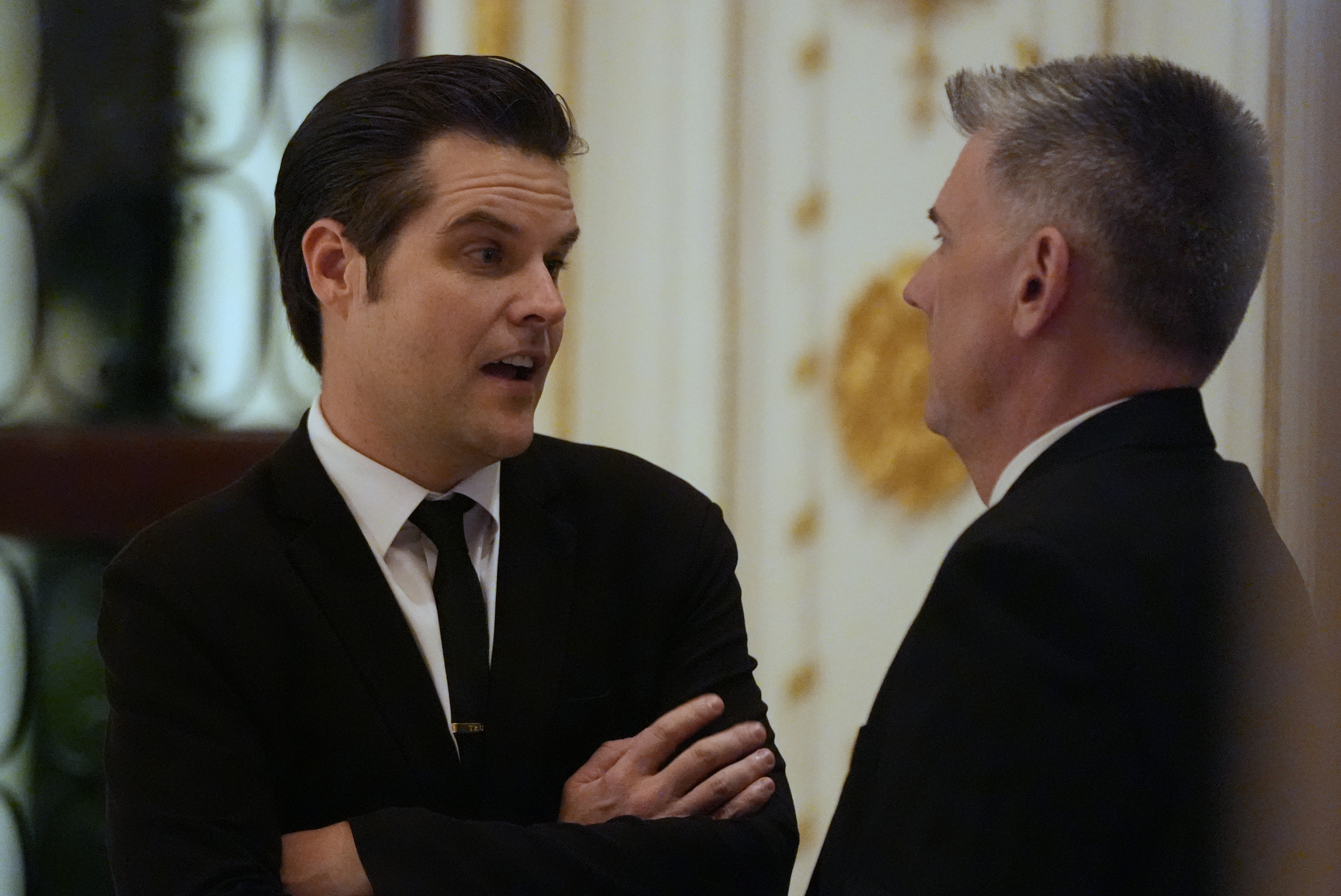 Matt Gaetz speaks with another man at Mar-a-Lago