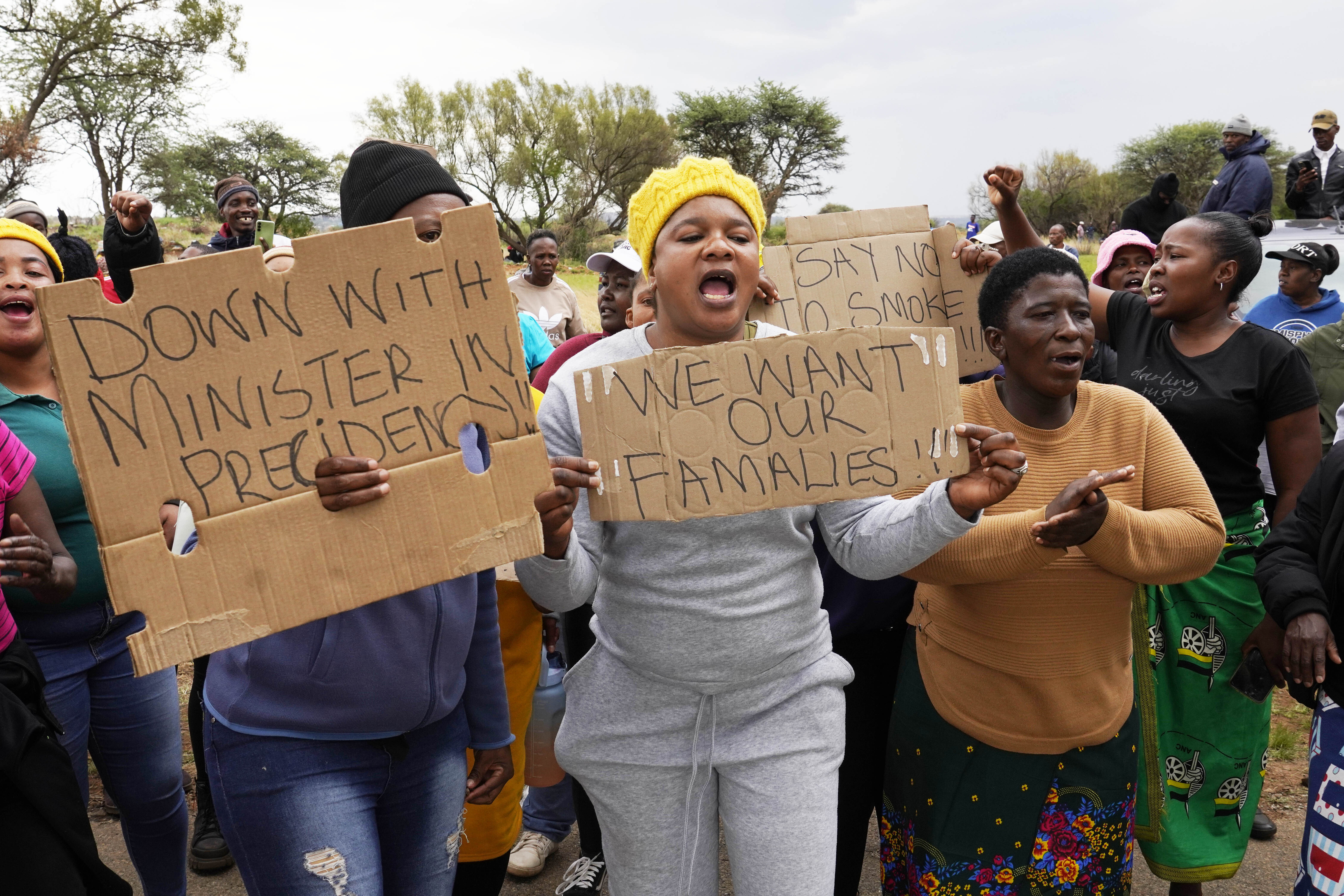 Relatives and friends protested near a reformed gold mineshaft where the illegal miners were trapped