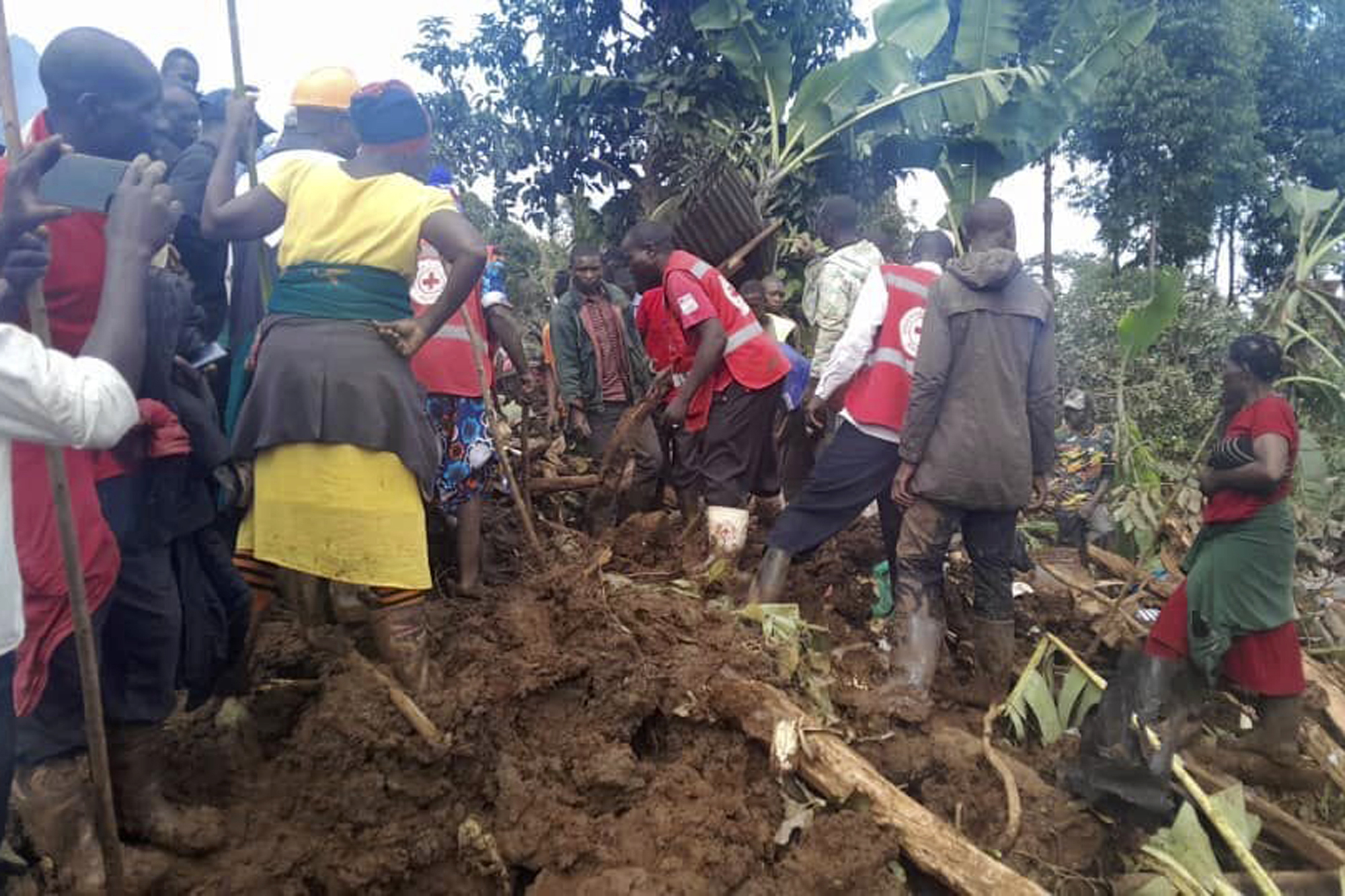 Uganda Red Cross workers search for bodies in the district of Bulambuli, Uganda