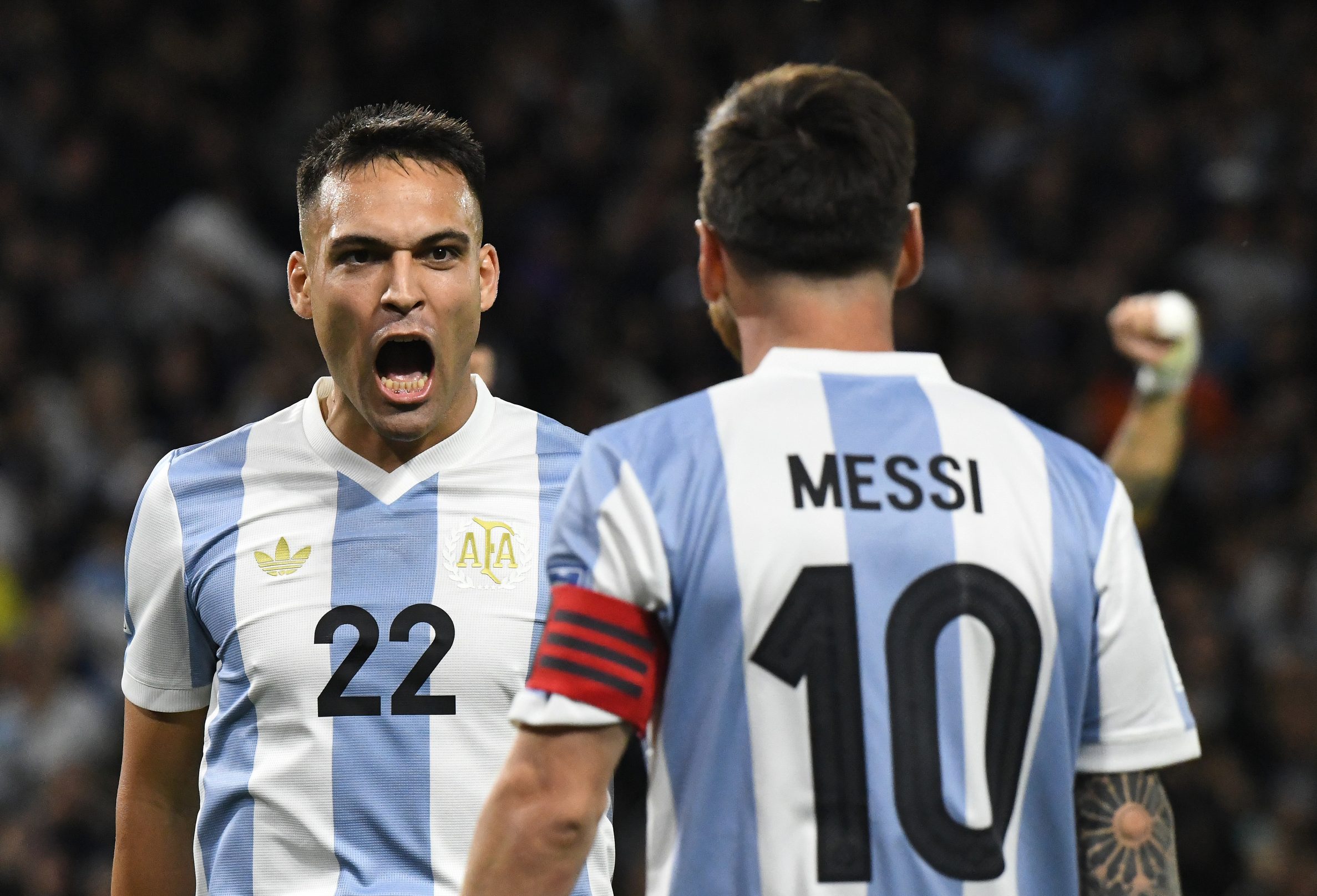 Lautaro Martinez and Lionel Messi of Argentina celebrate their team's goal during the match between Argentina and Peru at Alberto J. Armando - La Bombonera Stadium, in Buenos Aires, Argentina, on November 19. (Photo by Federico Peretti/NurPhoto via Getty Images)