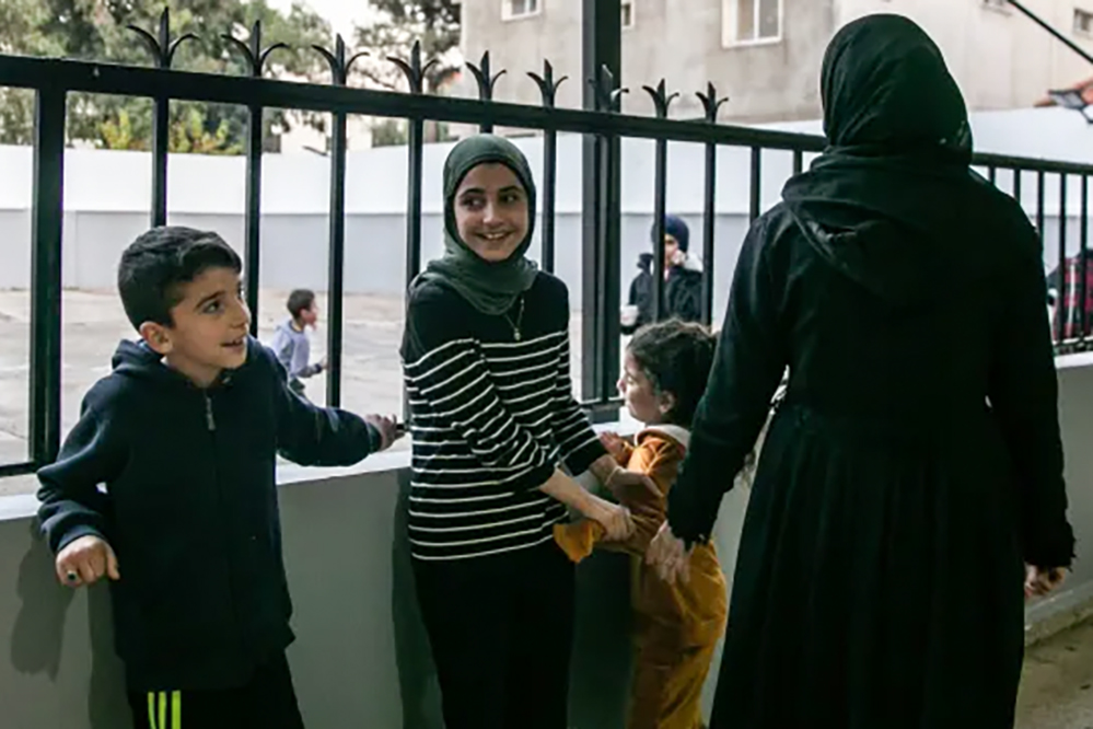 Shifa with her three children: Raneem, 12, Taleen, 7, and 9-year-old Ali in Bar Elias, Lebanon