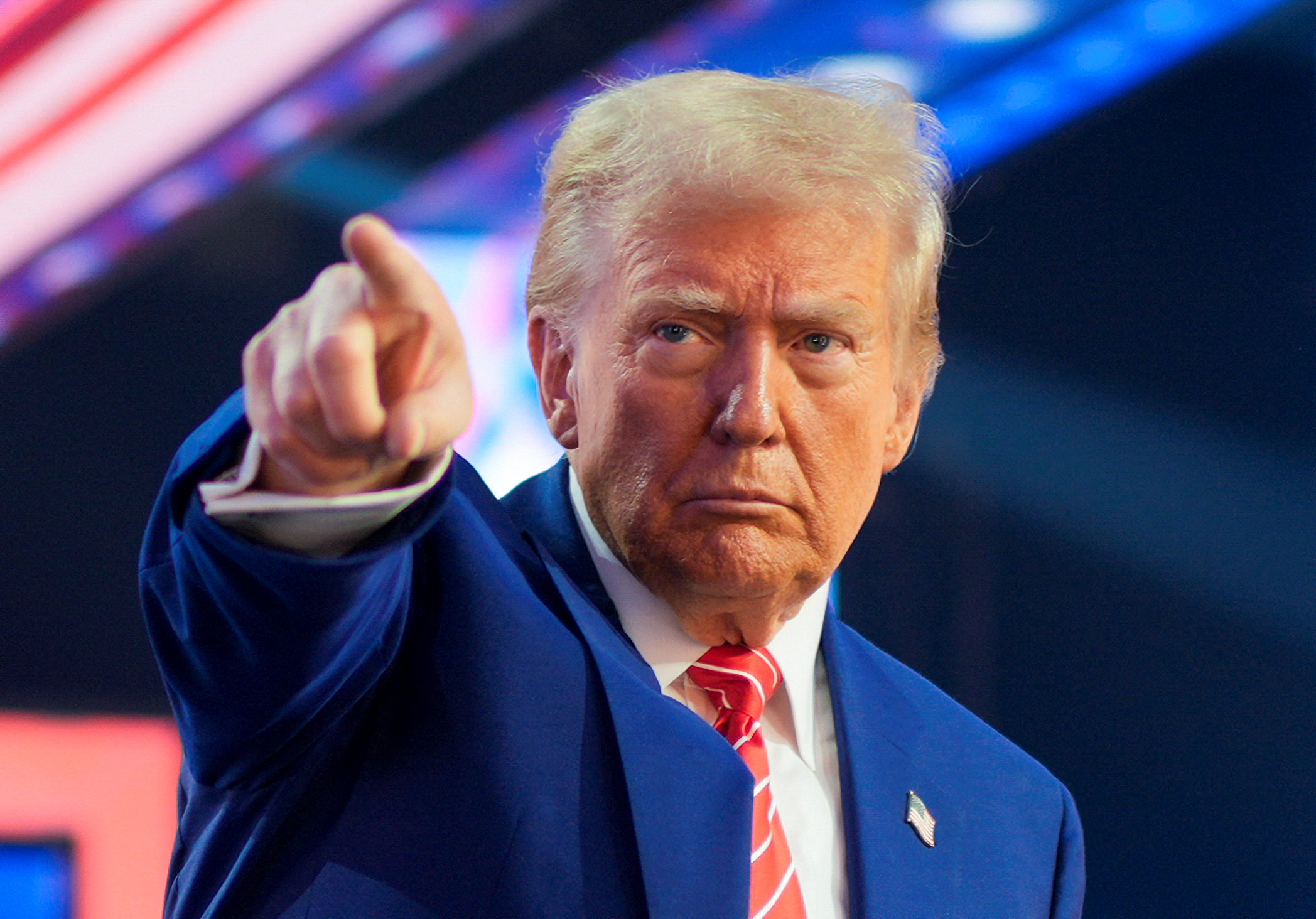 U.S. President-elect Donald Trump gestures at Turning Point USA's AmericaFest in Phoenix, Arizona