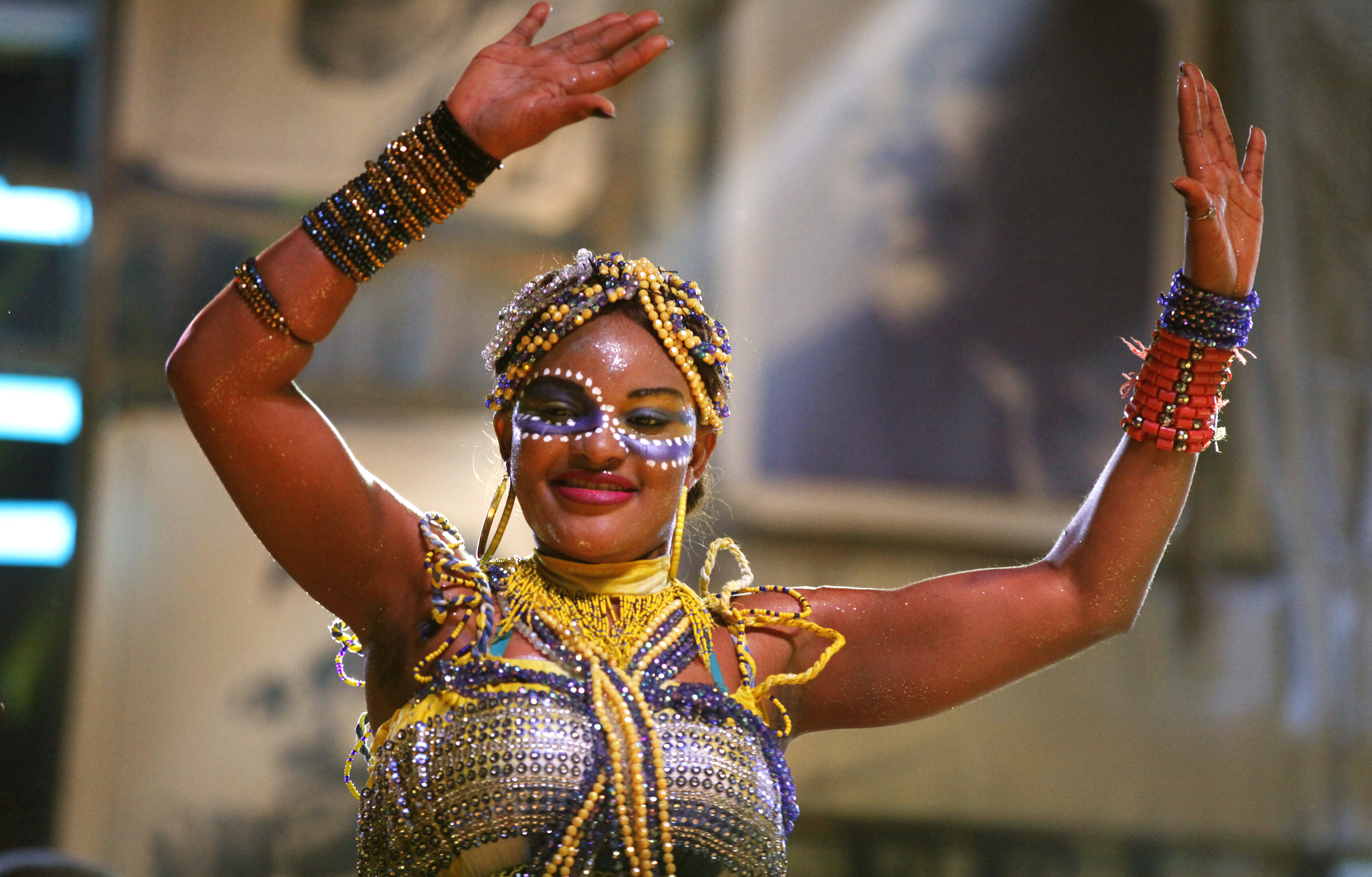 A backup singer on stage at a concert in Lagos