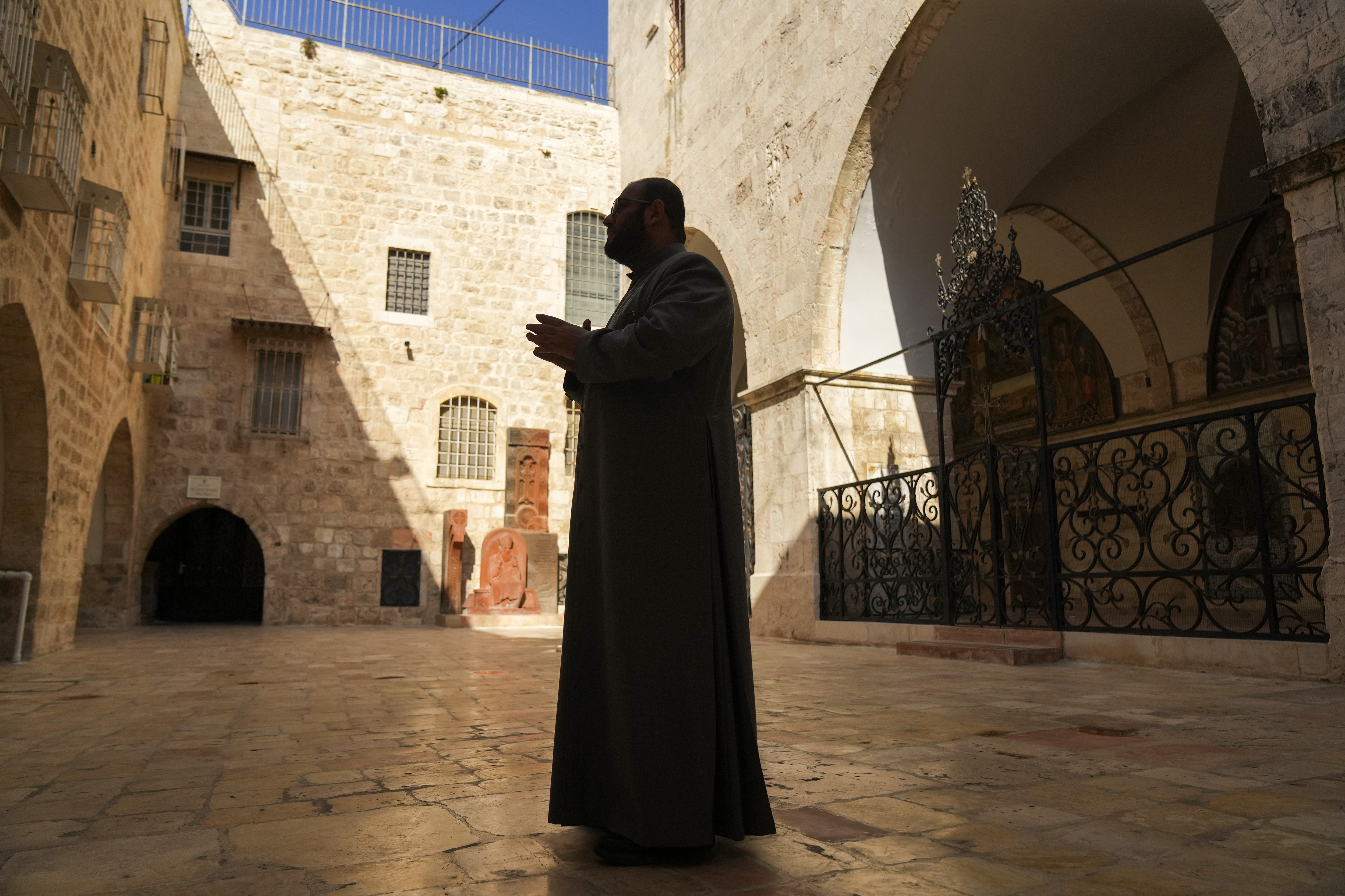 Father Aghan Gogchyan, chancellor of the Armenian Patriarchate of Jerusalem, stands outside St James Cathedral in the Armenian Quarter of occupied East Jerusalem
