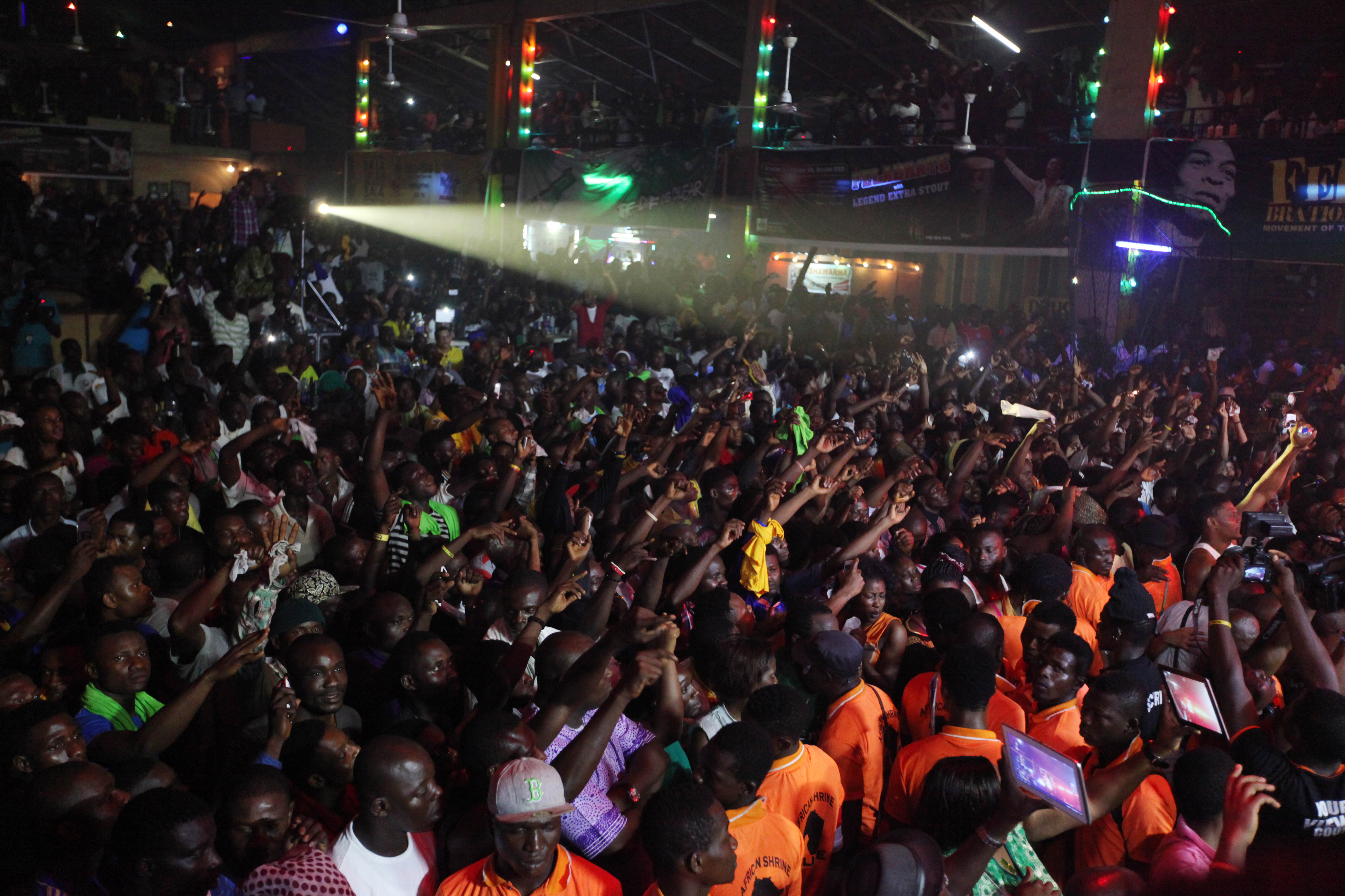 Fans wave their hands at a concert in Nigeria