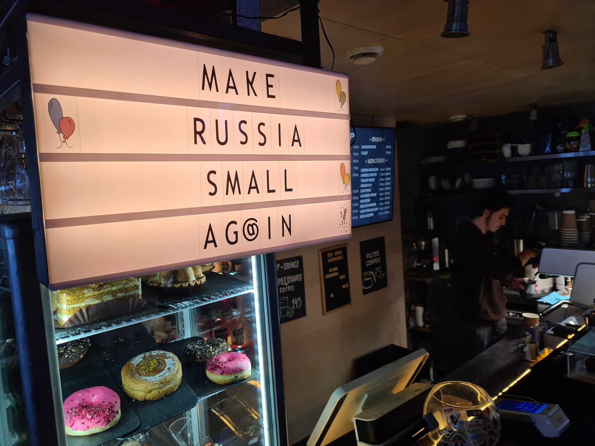 A sign reading 'Make Russia Small Again' in a Kyiv cafeteria named after US President Donald Trump-1737104862